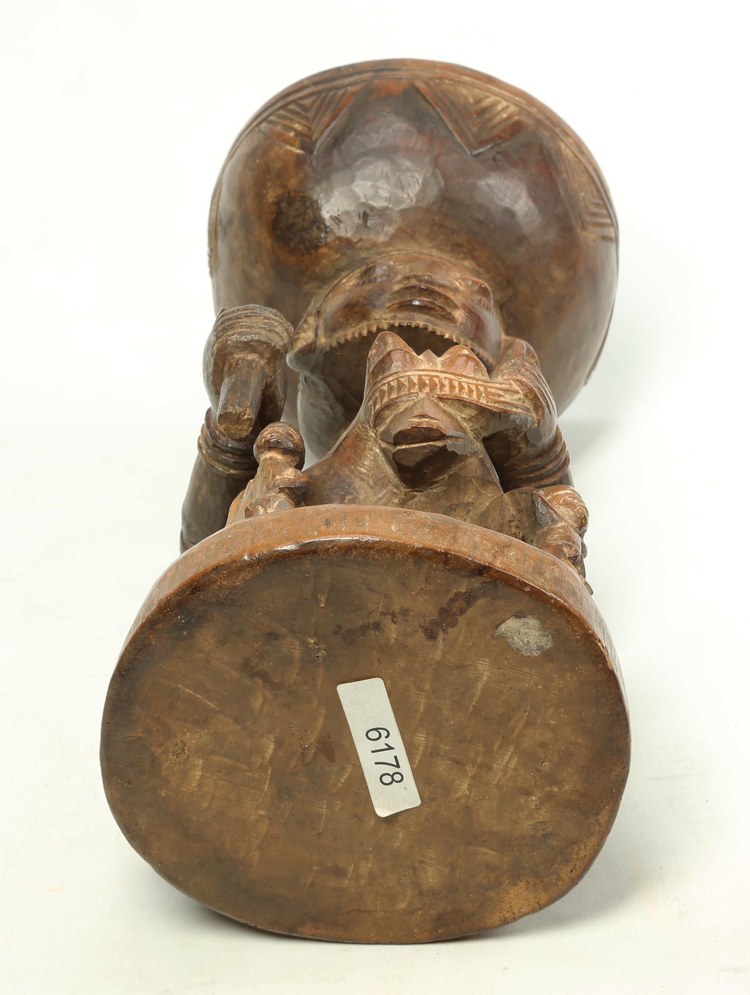 Finely carved wood offering bowl in form of horse and rider with four smaller figures at each corner. Yoruba People, Nigeria. Created in the early part of the 20th century. Wood with polish and patina from tribal use as a vessel for kola nuts.  