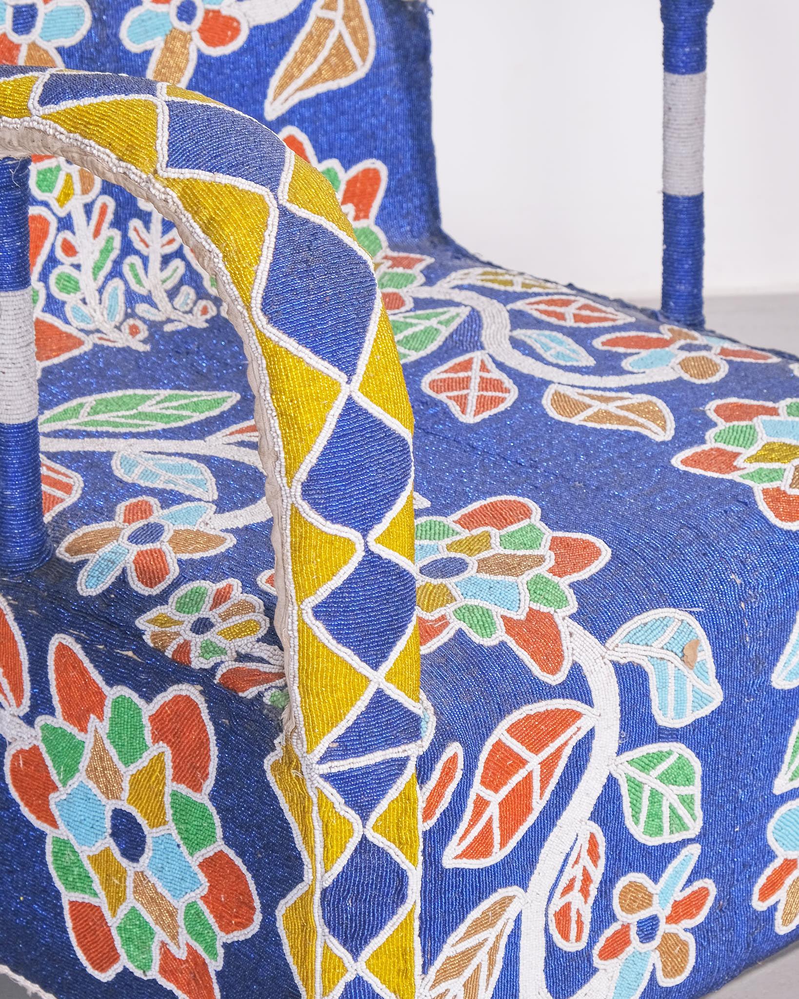 Yoruba Royal Beaded Chair, West Africa

A traditional Yoruba royal beaded chair, handcrafted in West Africa. These chairs were historically made for Yoruba kings and high-ranking individuals as symbols of status and authority.

The chair features an