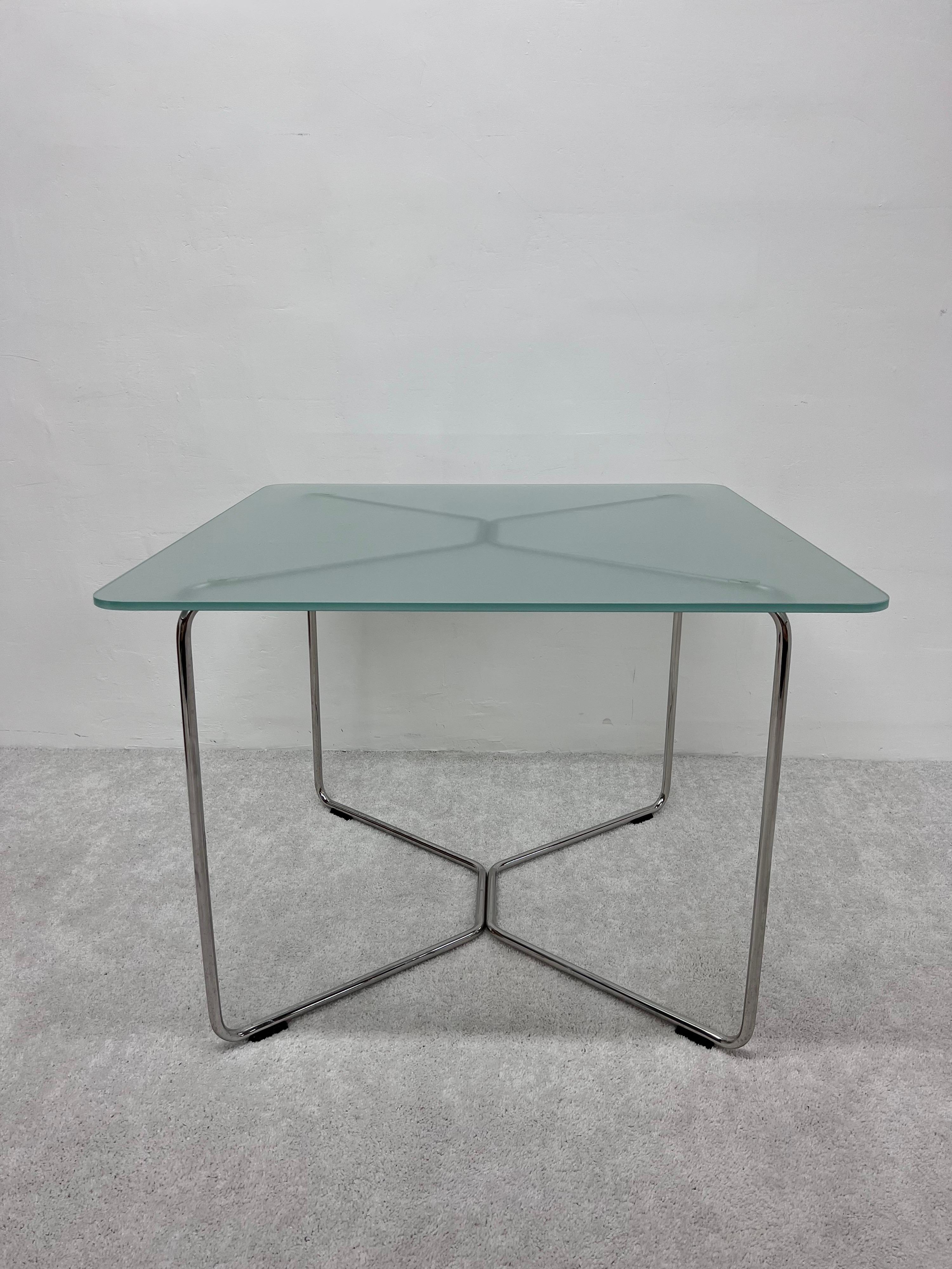 leonardo glass and chrome metal dining table
