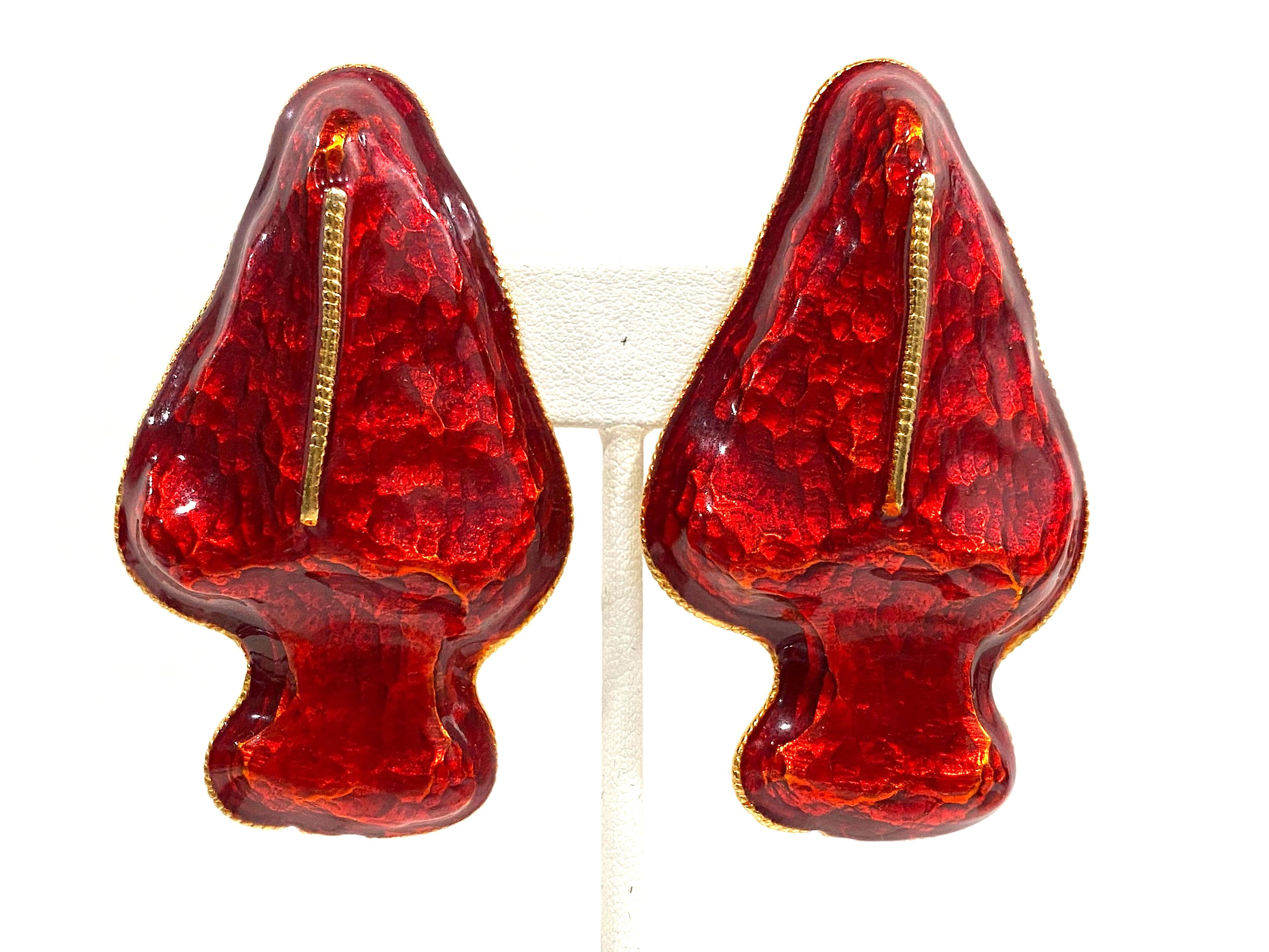 Presented is a unique, rare design large pair of 1980s Gerard Yosca red enamel earrings. Each earring measures 1.5 inches wide and 2.5 inches long. They are three dimensional and protrude outward or peak along the center .65 of an inch in dept. The