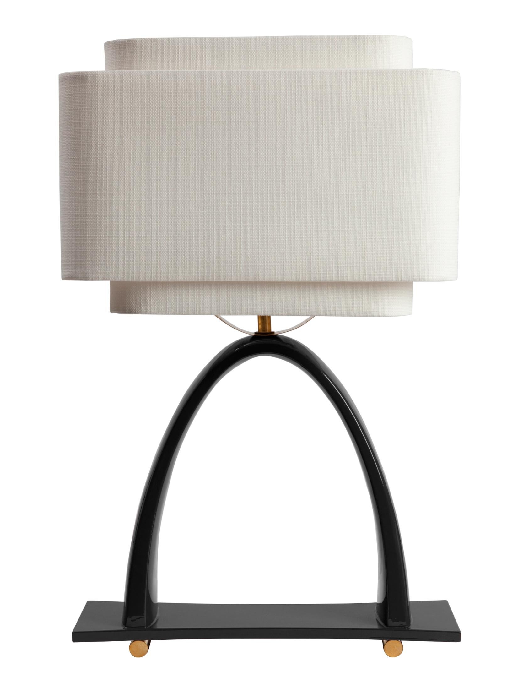 Yoshiko Table Lamp by Kira Design
Dimensions: ⌀ 37 x H 58 cm
Materials: Ceramic, Linen, Brass, Lacquered Wood
Available Colors: Blue, Red, Green, Black.

The Yoshiko desk lamp reveals delicate, slender curves, counterbalanced by a double shade that