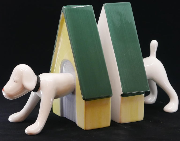 A pair of bookends by Yoshitomo Nara for Bozart circa 2002. Manufacturer's mark and signature printed on inside of one bookend.