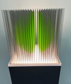 Green kinetic sphere sculpture
