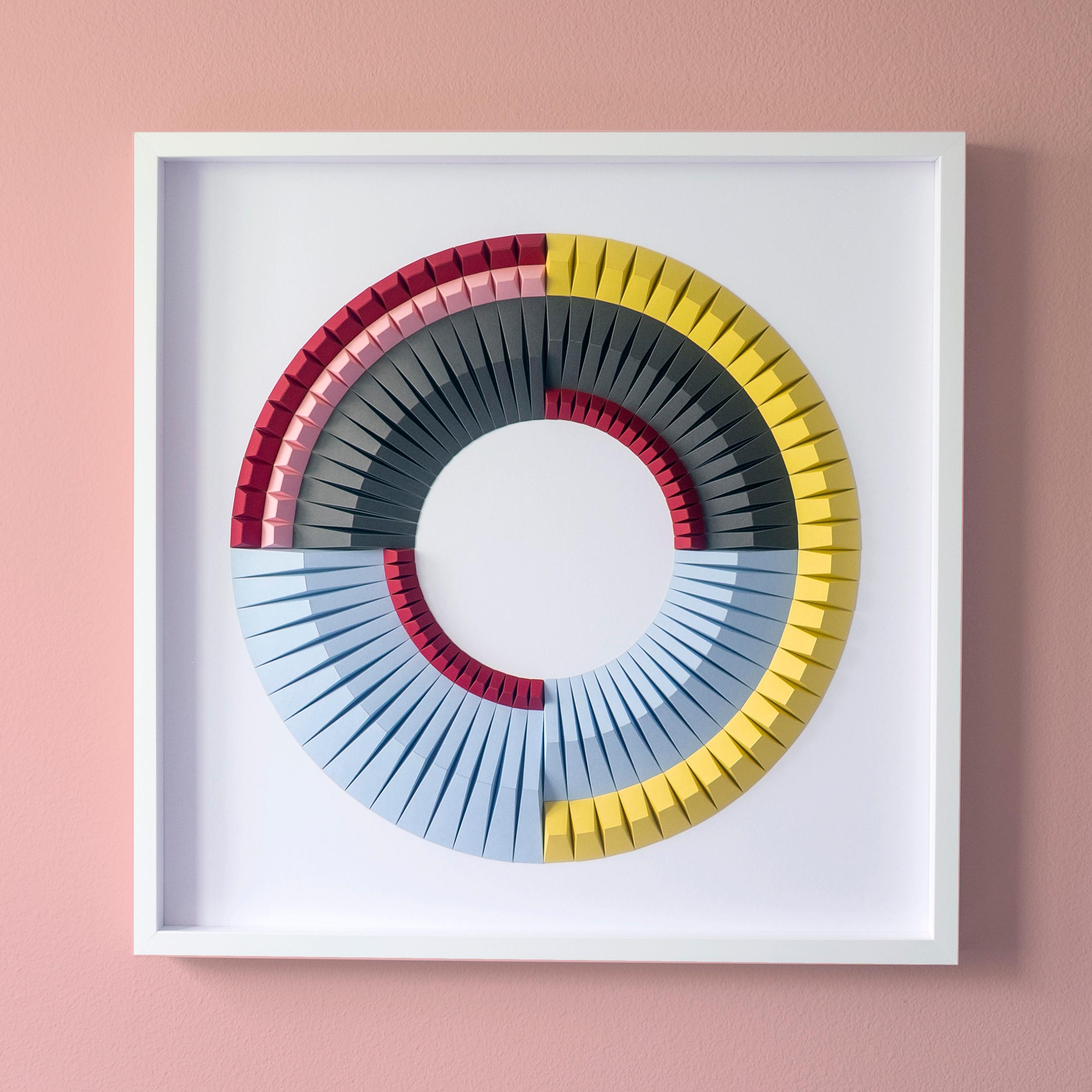 This beautiful geometric abstract wall sculpture is made out of colored laser cut paper that was hand folded by Yossi Ben Abu. It comes in white wooden frame and a non glare museum glass.
