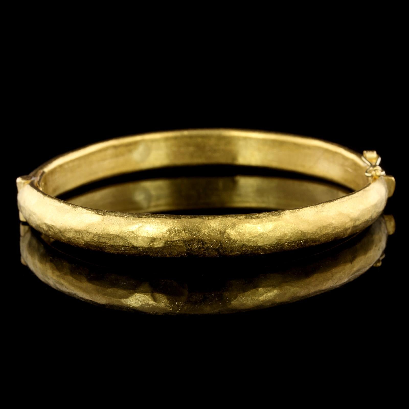 Yossi Harari 24K Yellow Gold Bangle Bracelet. The bracelet is a hinged bangle, interior
circumference 7