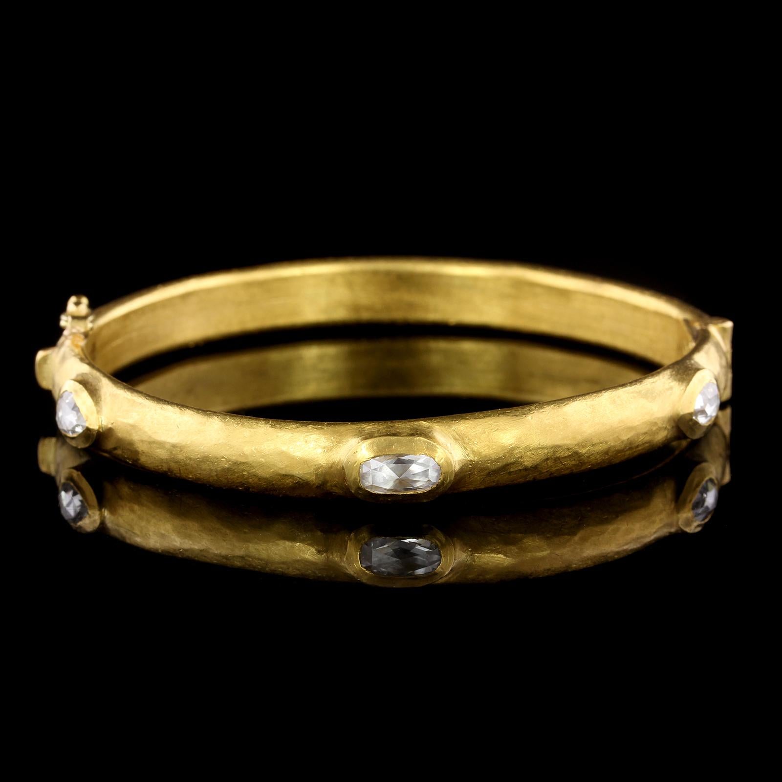 Yossi Harari 24K Yellow Gold Diamond Bangle Bracelet. The bracelet is a hinged bangle
set with three rose cut diamonds, approx. total wt. 1.25cts., interior
cirmference 7