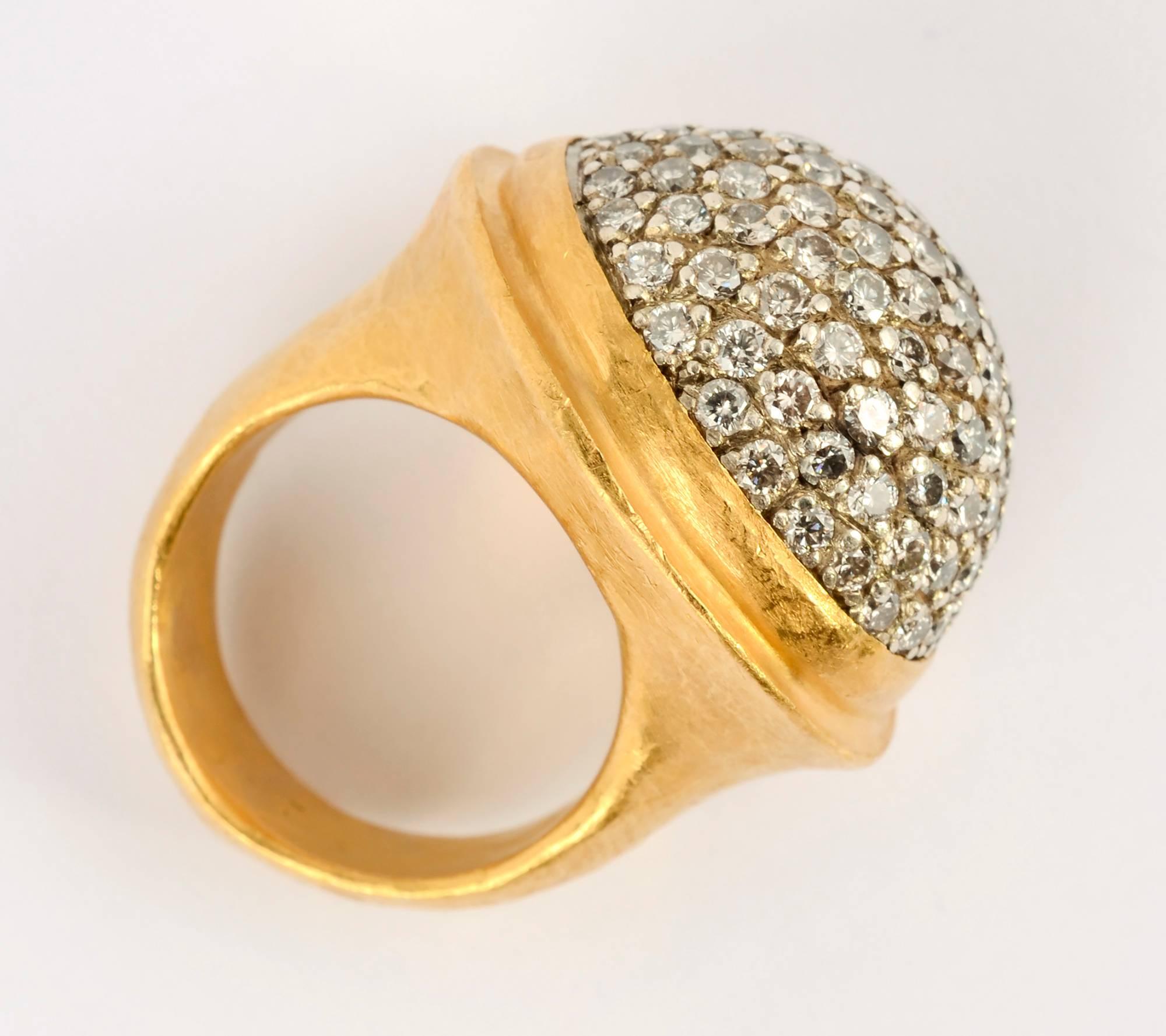 Stunning oval dome ring by Yossi Harari. It is set with pave diamonds. The ring is 24 karat hammered gold. It is size 6.