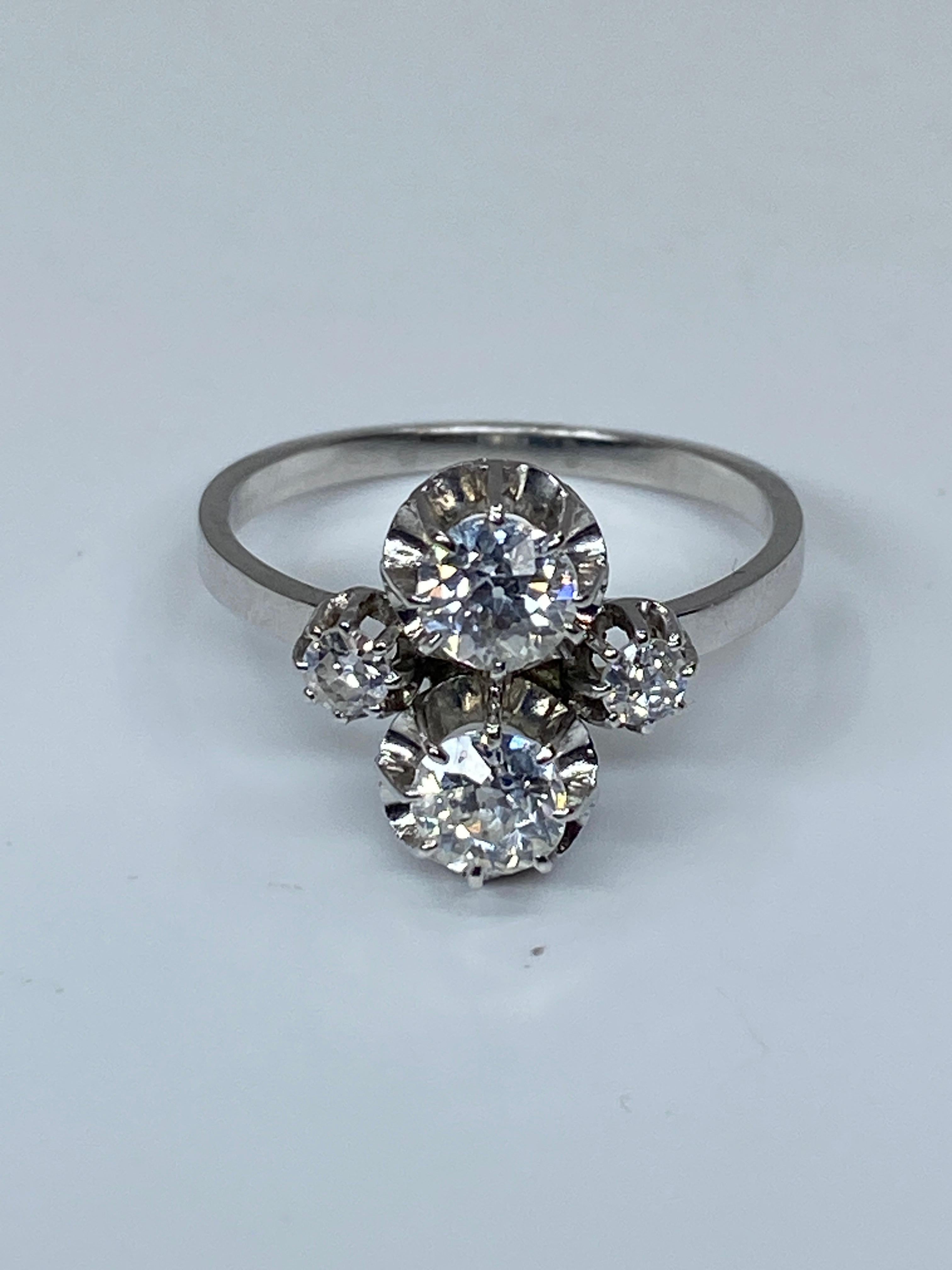 Round Cut You and Me Ring in 18 Carat Gold and Platinium Set with Diamonds, circa 1930 For Sale