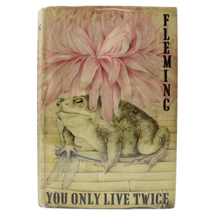 Fleming, Ian, You Only Live Twice. London: Jonathan Cape, 1964. First edition. Octavo. In the original publisher’s black cloth boards with the front lettered in gilt and spine titled in silver. Original unclipped dust jacket.
Presented is the first