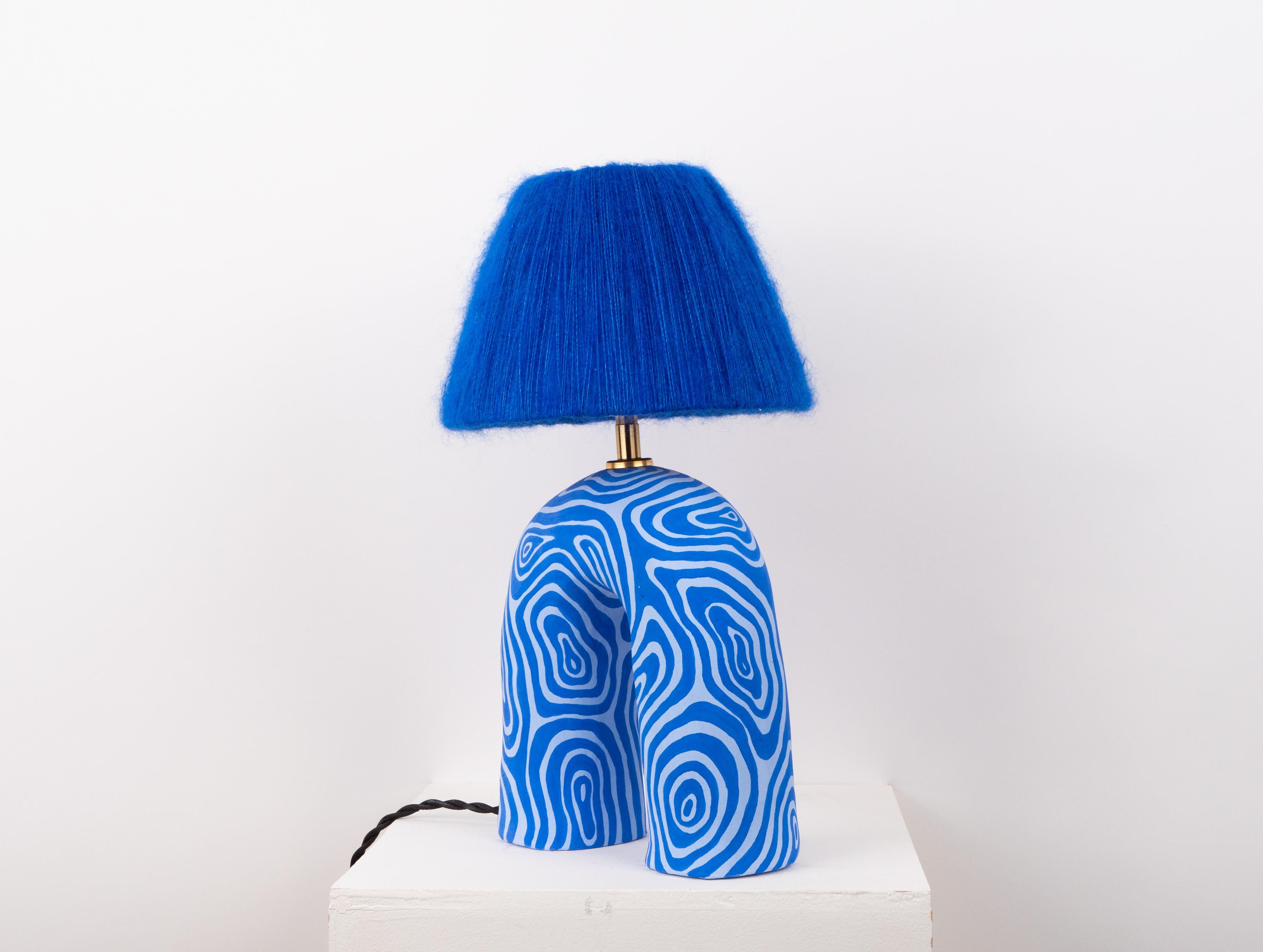 Two Tone Blue Swirl Pattern with a Matte Finish and Blue Mohair Silk Shade

Estimated processing time is 2 weeks from order confirmation.

Pictured with a Mini Globe LED E27 Bulb. Bulb not included.

If you would like to alter the colour of the lamp