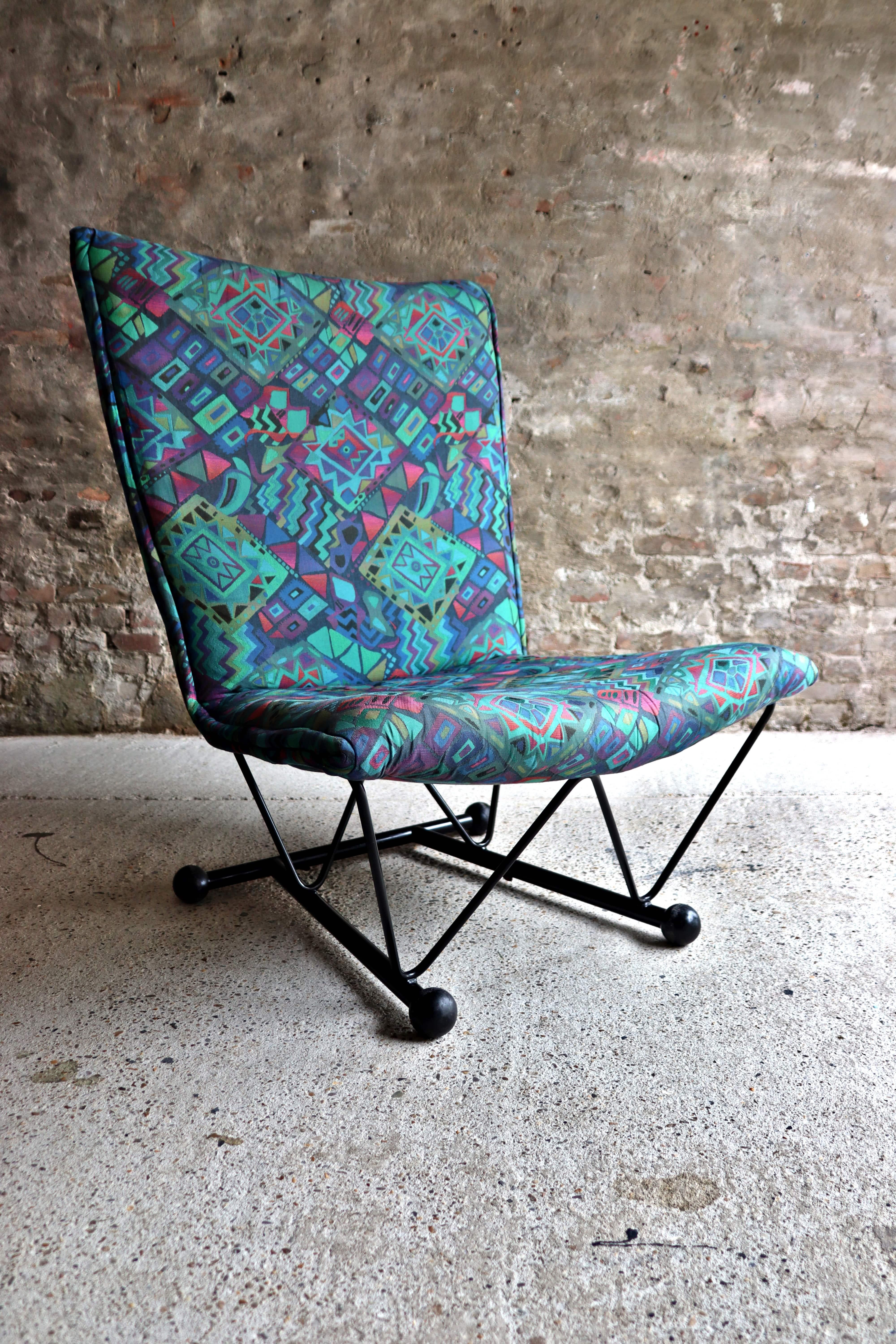 This cool vintage 1980s armchair is called Flyer chair and is designed by Pierre Maizarac and Karel Boonzaadjer for Young International (a label or brand of Gelderland). Beautiful fabric in good condition. It has minor signs of age and