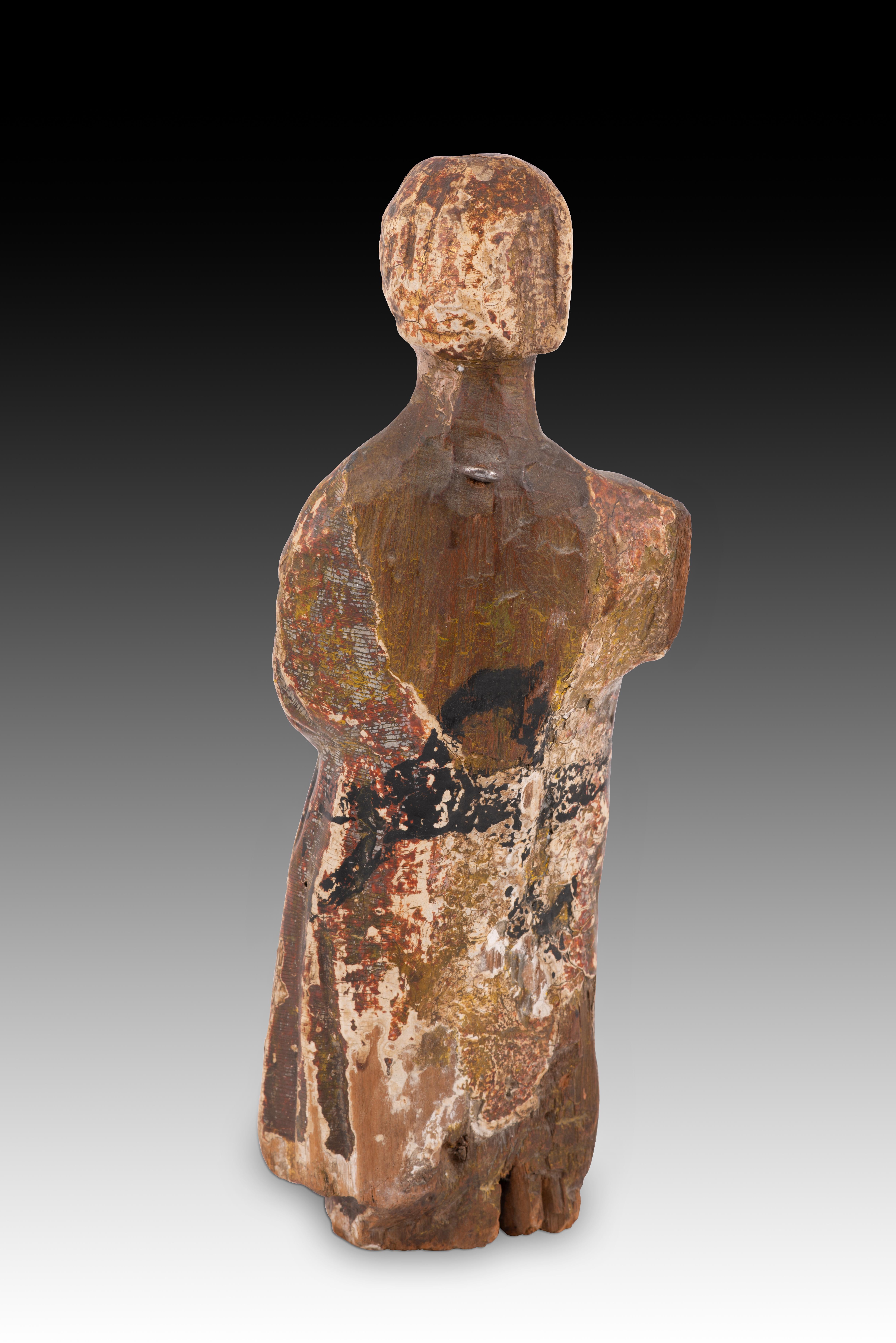Young man in a tunic. Carved and polychrome wood. Spanish school, 14th century. In Distressed Condition In Madrid, ES