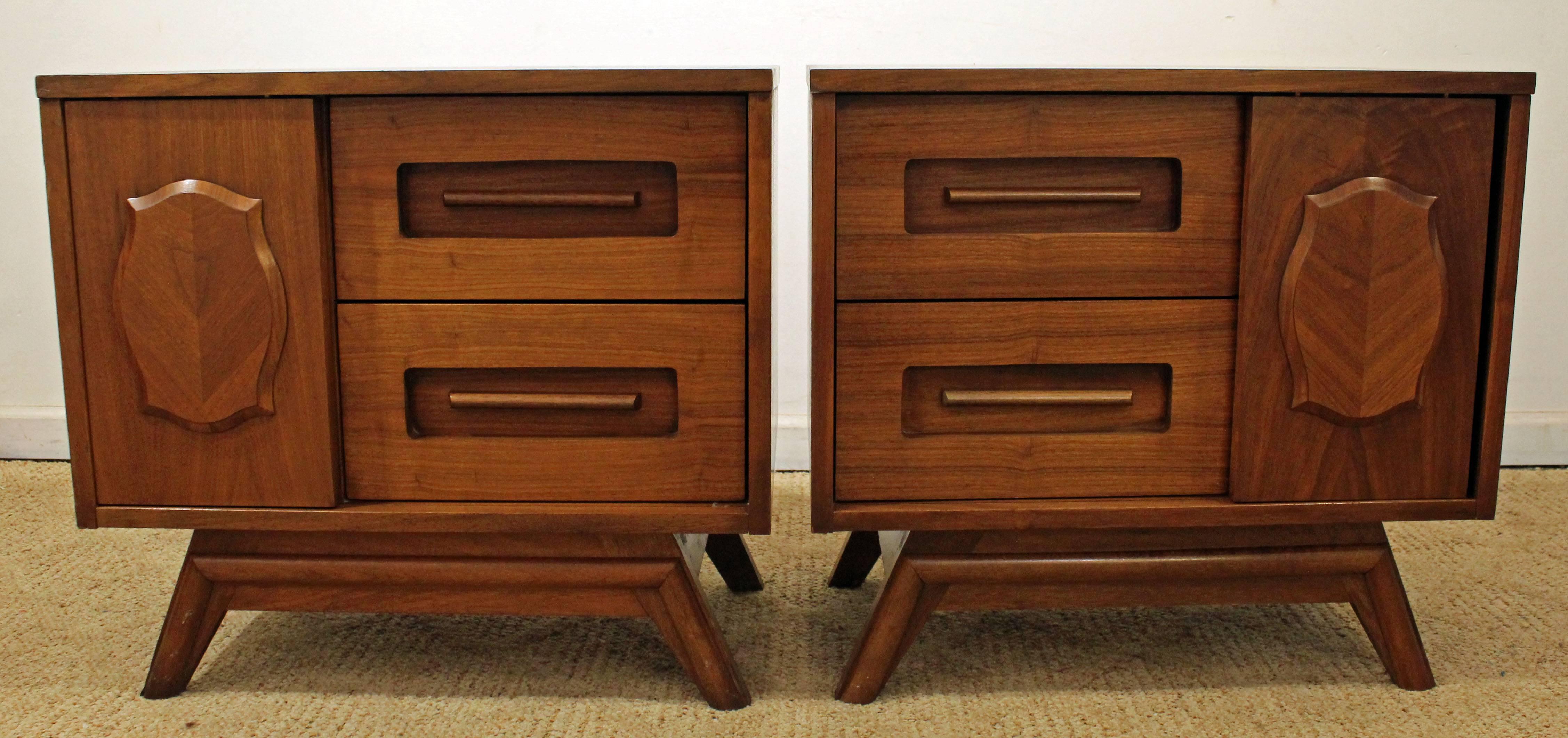 This set is made of walnut and feature parqueted sliding doors. They have been refinished. They are signed by Young Mfg Co. Check out our other listings for a matching credenza.

Dimensions:
20