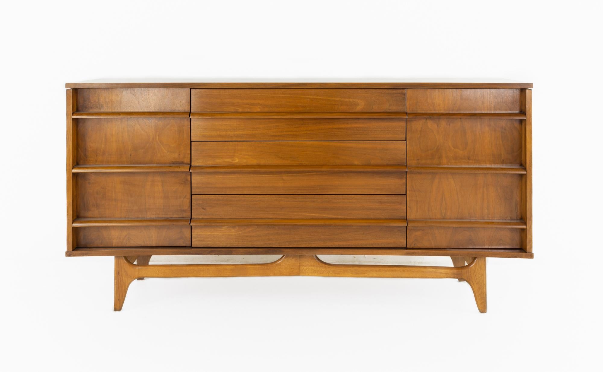 Young Manufacturing mid century buffet sideboard credenza

This buffet measures: 64 wide x 18 deep x 34 inches high

All pieces of furniture can be had in what we call restored vintage condition. That means the piece is restored upon purchase so