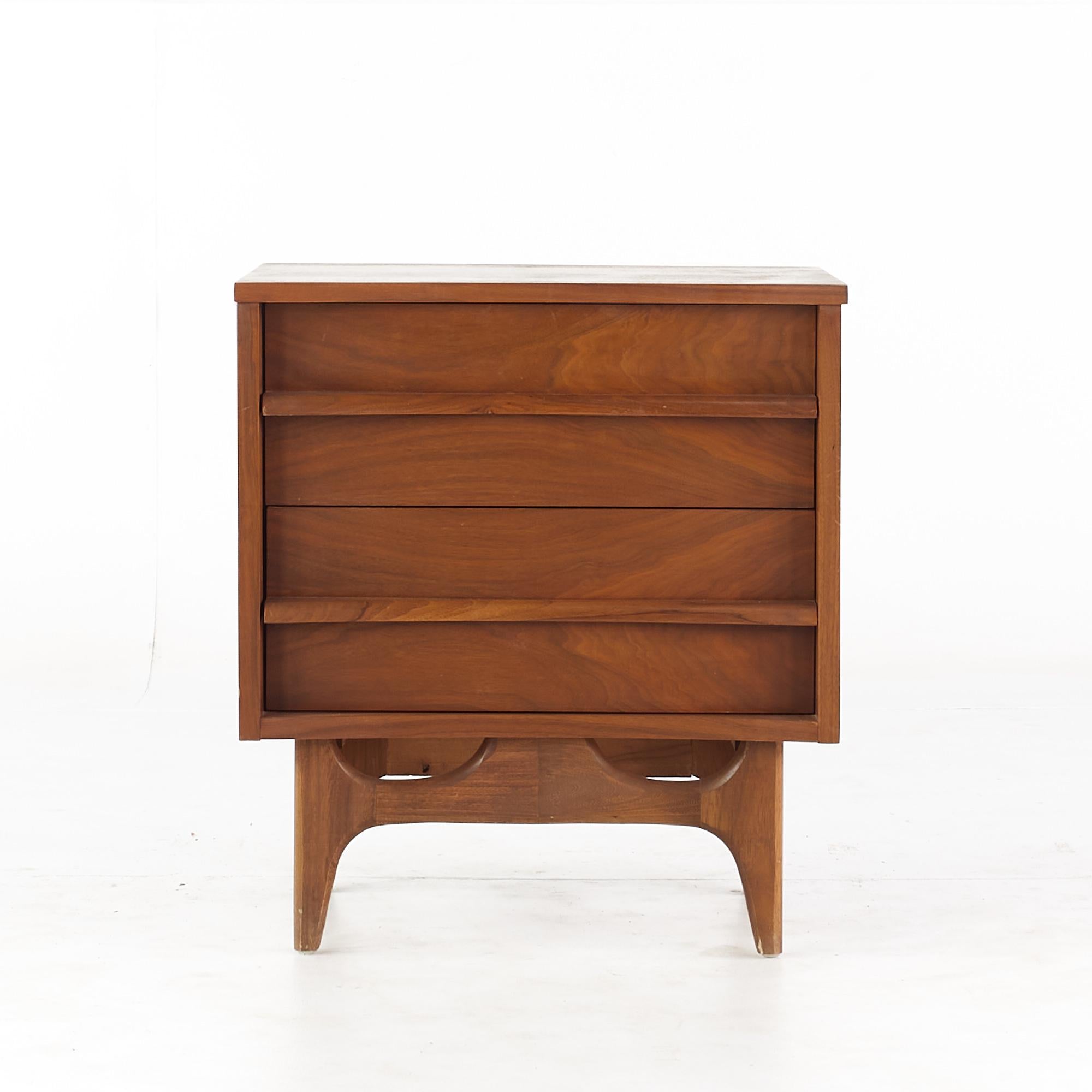 Young Manufacturing mid-century walnut curved nightstand.

This nightstand measures: 22 wide x 17 deep x 27.75 inches high.

All pieces of furniture can be had in what we call restored vintage condition. That means the piece is restored upon