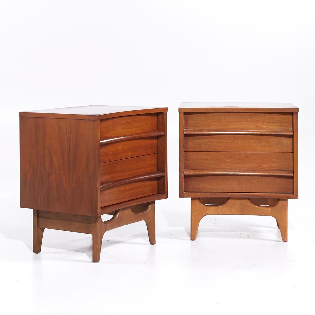 Young Manufacturing Mid Century Walnut Curved Nightstands - Pair

Each nightstand measures: 22 wide x 17 deep x 24.75 inches high

All pieces of furniture can be had in what we call restored vintage condition. That means the piece is restored upon