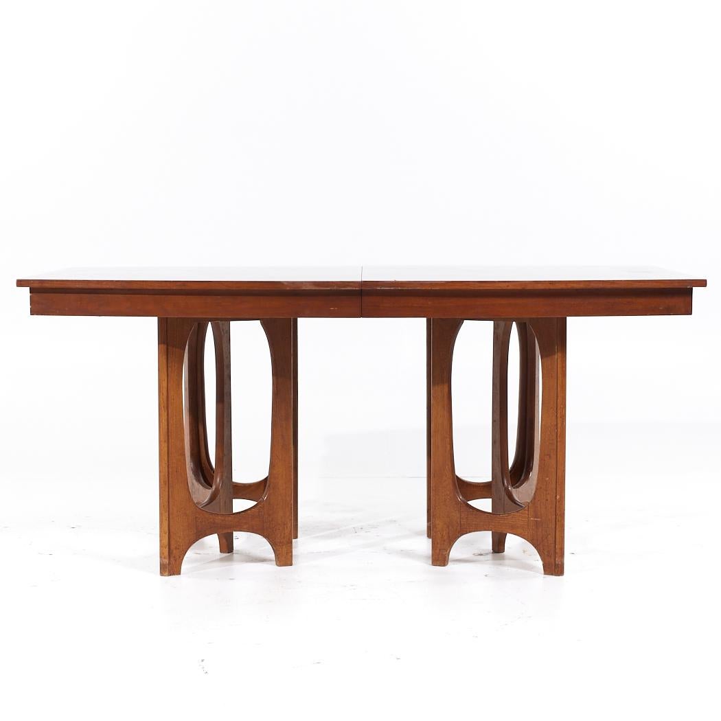 Young Manufacturing Mid Century Walnut Expanding Dining Table with 2 Leaves

This table measures: 66 wide x 42 deep x 29.5 inches high, with a chair clearance of 25.75 inches, each leaf measures 18 inches wide, making a maximum table width of 102