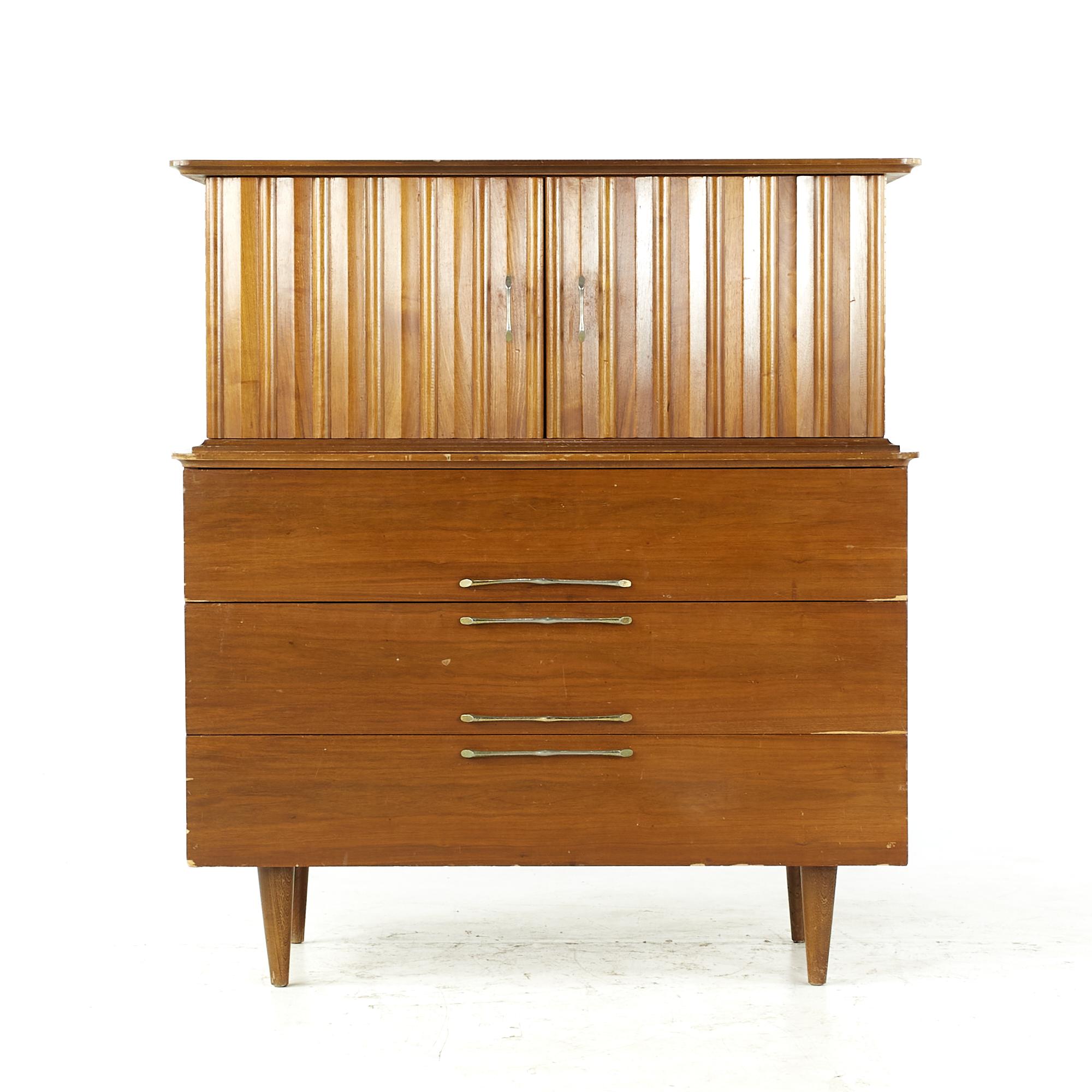 Young manufacturing midcentury Walnut highboy dresser.

This highboy measures: 42 wide x 19 deep x 46.75 inches high

All pieces of furniture can be had in what we call restored vintage condition. That means the piece is restored upon purchase