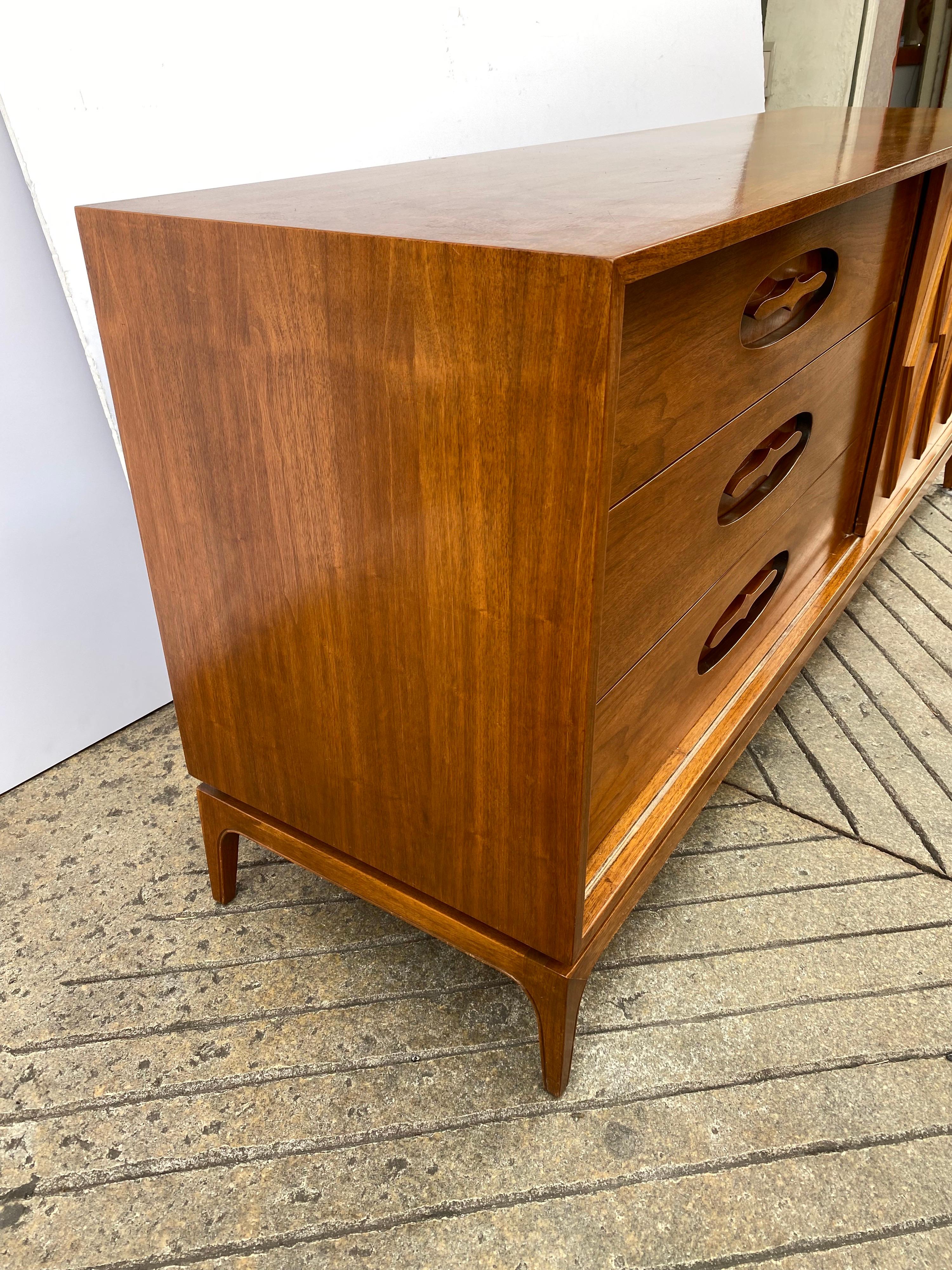 Young Manufacturing walnut 6 drawer dresser or credenza. Tons of Storage with a Sliding Door. Drawers are nice size and scale, all work very well. Unique recessed area around drawer handles. Diamond pattern design on door. All Original! Shows minor
