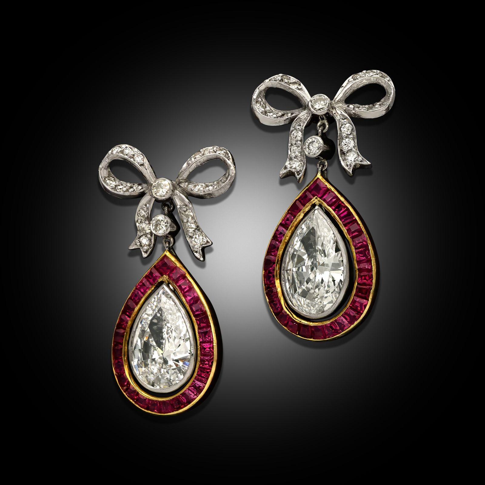 Maker:
Young & Stephens
Summary:
1.57ct Pear Shape Diamond & Ruby Drop Earrings
Description:
A pair of pear shaped diamond and calibrated ruby drop earrings by Young & Stephens, circa 1985. Each earring is set to the top with a diamond and platinum