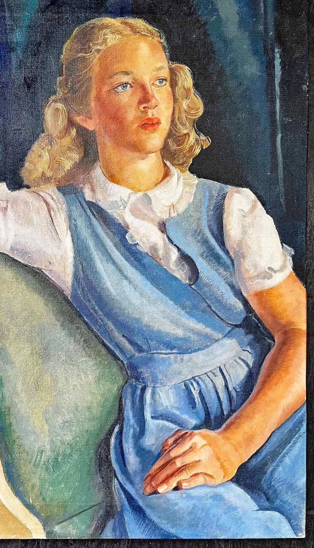 This fresh and vibrant portrait of a young woman with glowing blond hair and a blue 1940s frock is one of the finest World War II vintage portraits we have ever offered.  Her complexion is rosy and lovely, her arms and hands are beautifully