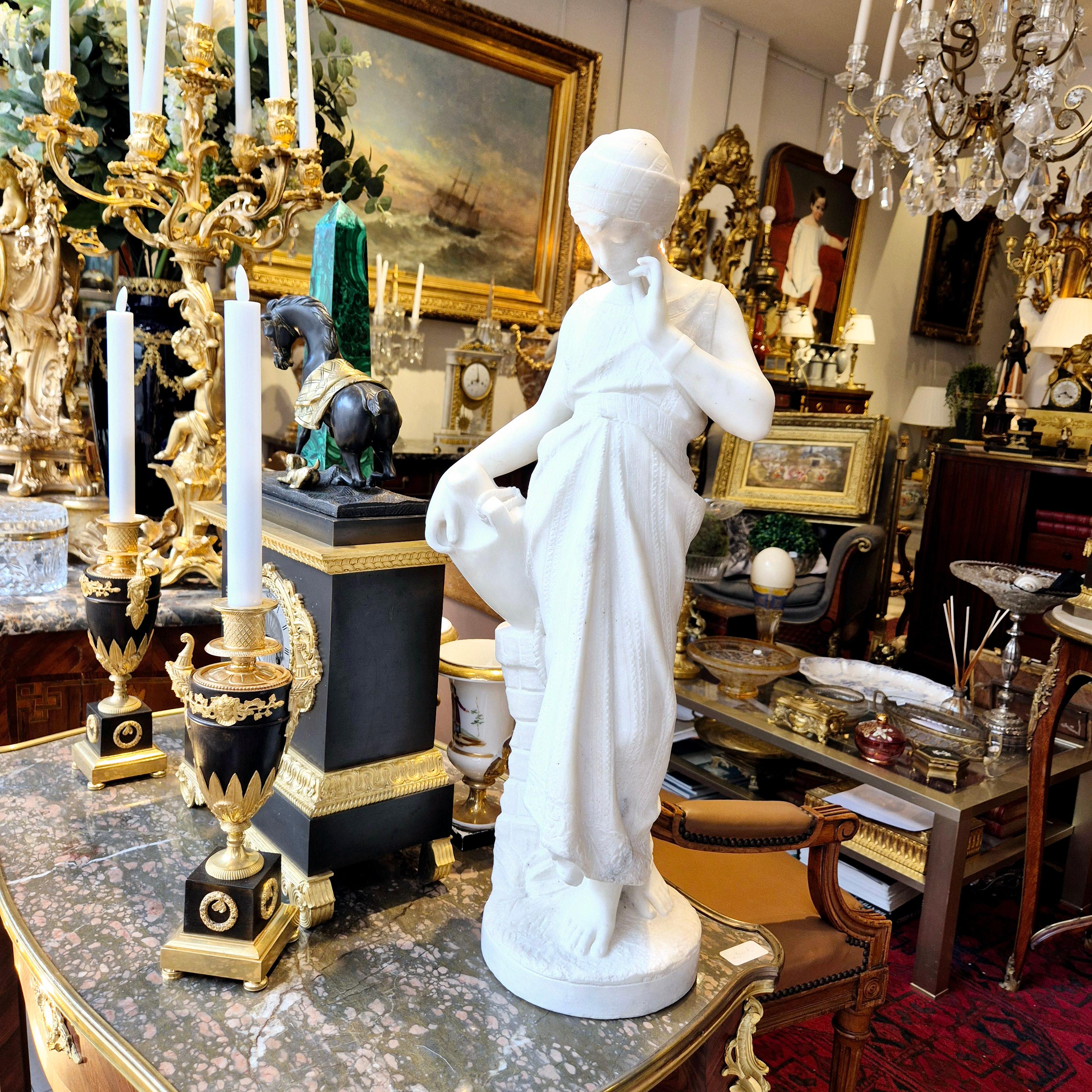 Charming sculpture of a young woman carrying a jug, signed by Bonnal on the back and inspired by “Rebecca at the Well” by 19th-century Italian School artist Guglielmo Pugi.

The sculpture in fine white Carrara marble, created between the end of the