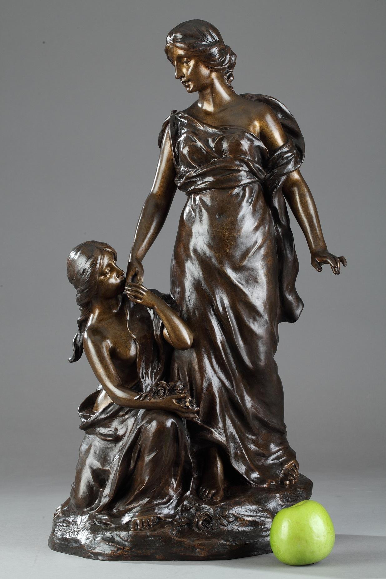 Late 19th century bronze group featuring two young women with flowers on a small naturalistic terrace. Signed on the terrace: KINSBURGER. Sculptor and engraver in medals, Sylvain Kinsburger (1855-1935) presented to the Paris Salon from 1878 onward,