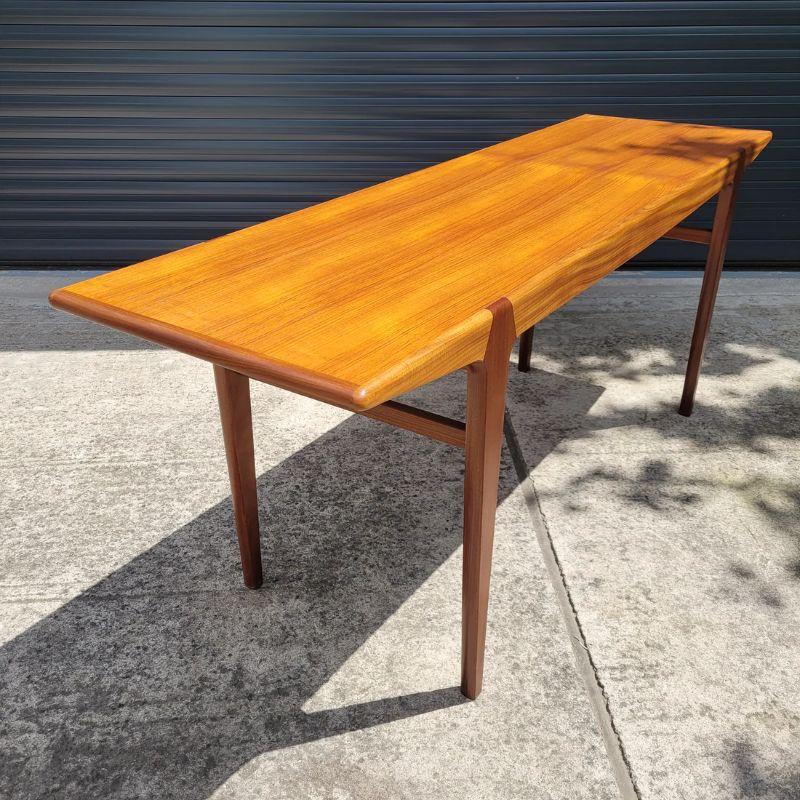 A beautifully designed and crafted dining table, designed by John Herbert for Younger, as part of their award winning 'Fonseca' range. 

This table was badly damaged so we have given it a new beginning by cutting it down to create this stunning