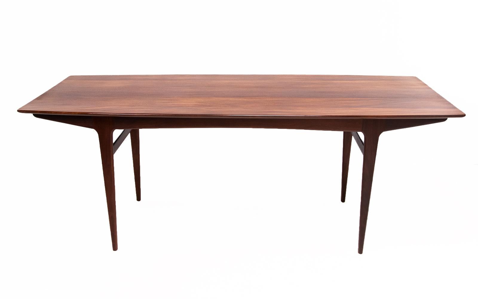 Younger mid century dining table 

A very well-made dining table in afromosia wood was made by Younger furniture in the 1950s and sold through Heals. 

A good size to comfortably seat 6. Mostly solid afromosia teak, with two stretchers and