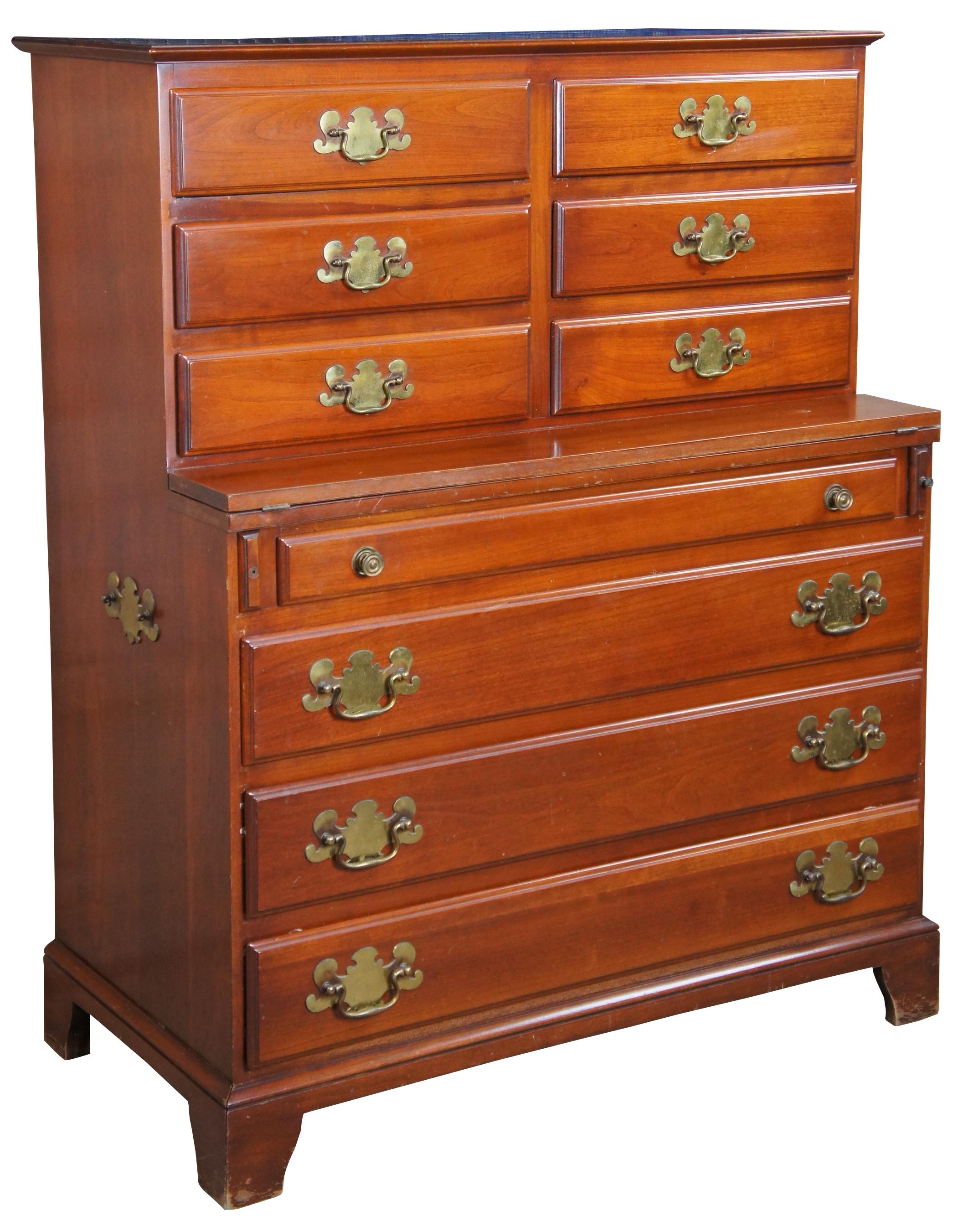 Vintage Youngsville Star MFG Co Sherwood Reproductions Colonial style chest or dresser. Made from cherry with a chest on chest design featuring a fold out surface and chippendale style hardware, Circa 1940 - 1965. 

Youngsville Star Manufacturing