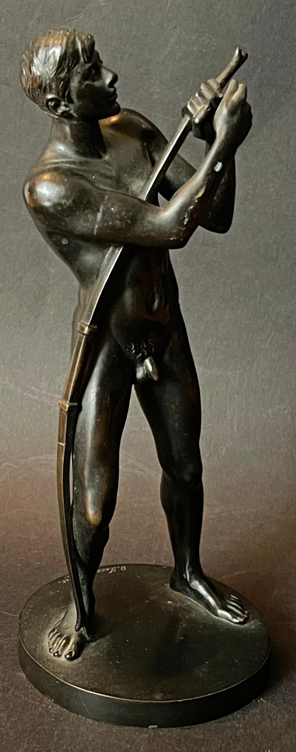 Diminutive and beautifully detailed, this unique -- to our knowledge -- bronze depicts a lithe male youth stringing his bow, his head tilted back in concentrated attention and his right leg bracing his body as he bends the bow. The artist was Otto