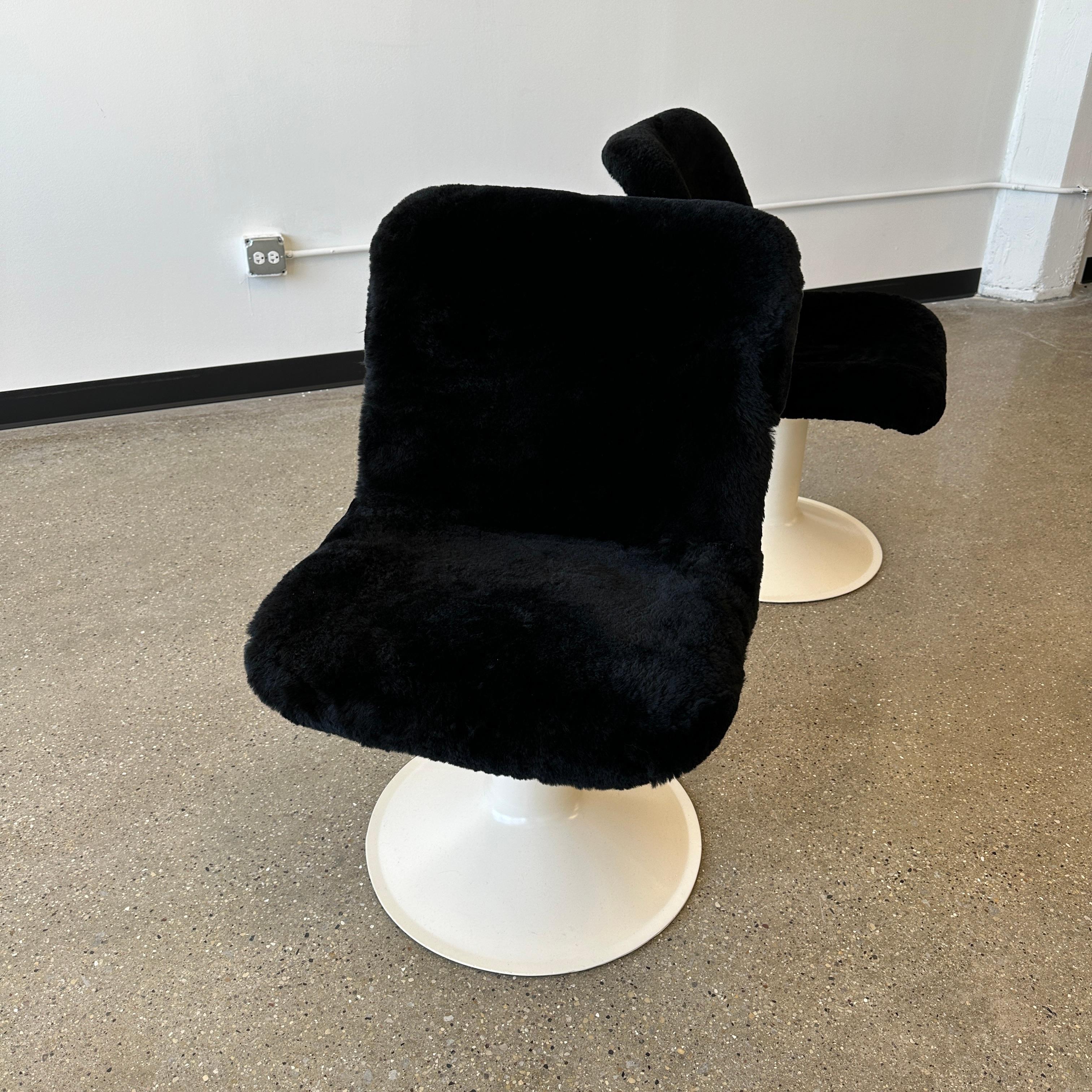 Model number 415 for Haimi c. 1960s, Finland. Both the bases and seats have been fully restored although there is still some vintage wear left on the frames. These have been redone in a lovely black shearling that adds significant cushioning and