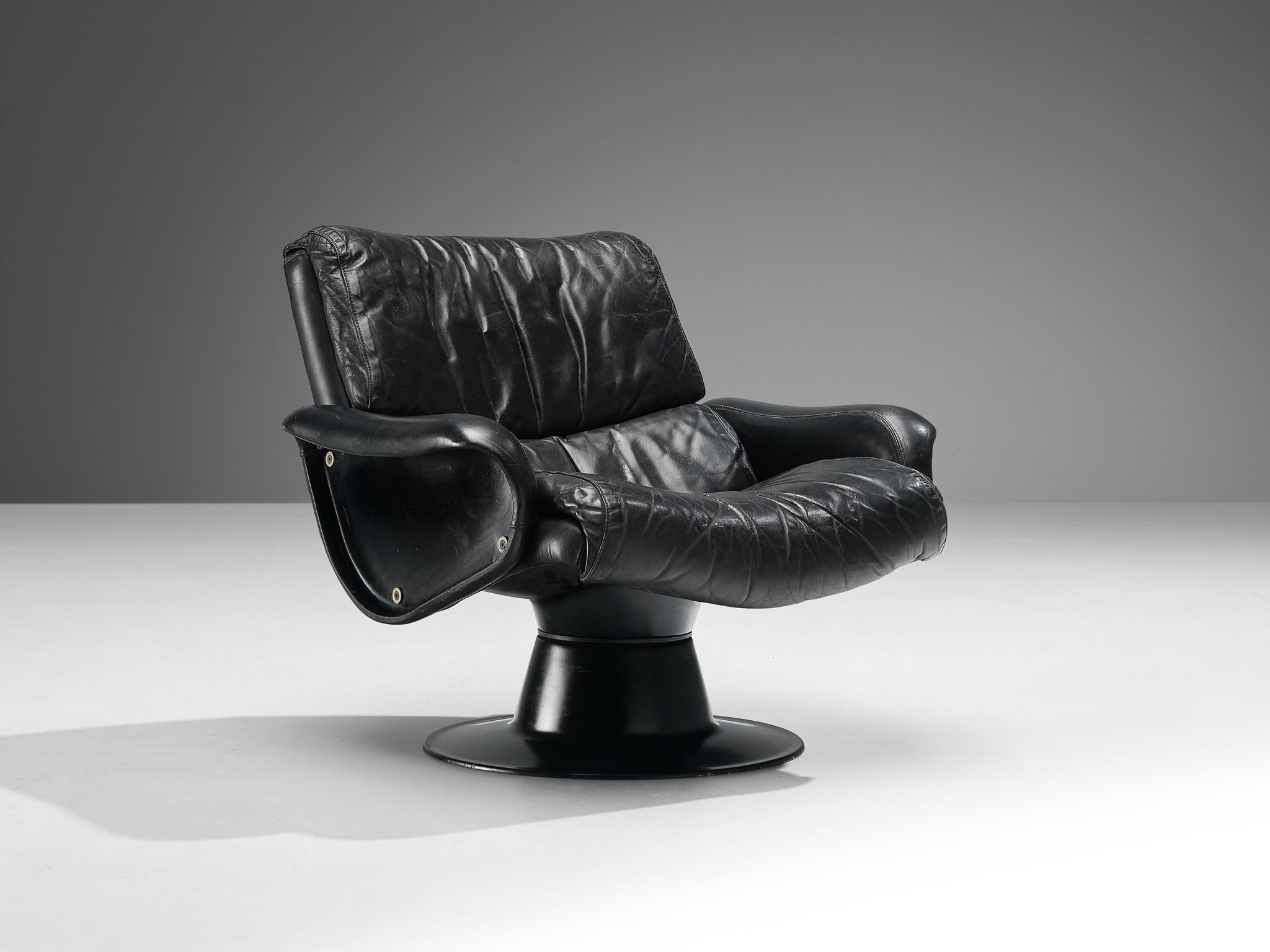 Yrjö Kukkapuro for Haimi, 'Saturnus' lounge chair, leather, fiberglass, Finland, 1960s.

Stunning easy chair in patinated black leather and fiberglass by Finnish designer Yrjö Kukkapuro. This organic shaped chair is made in a moulded fiberglass