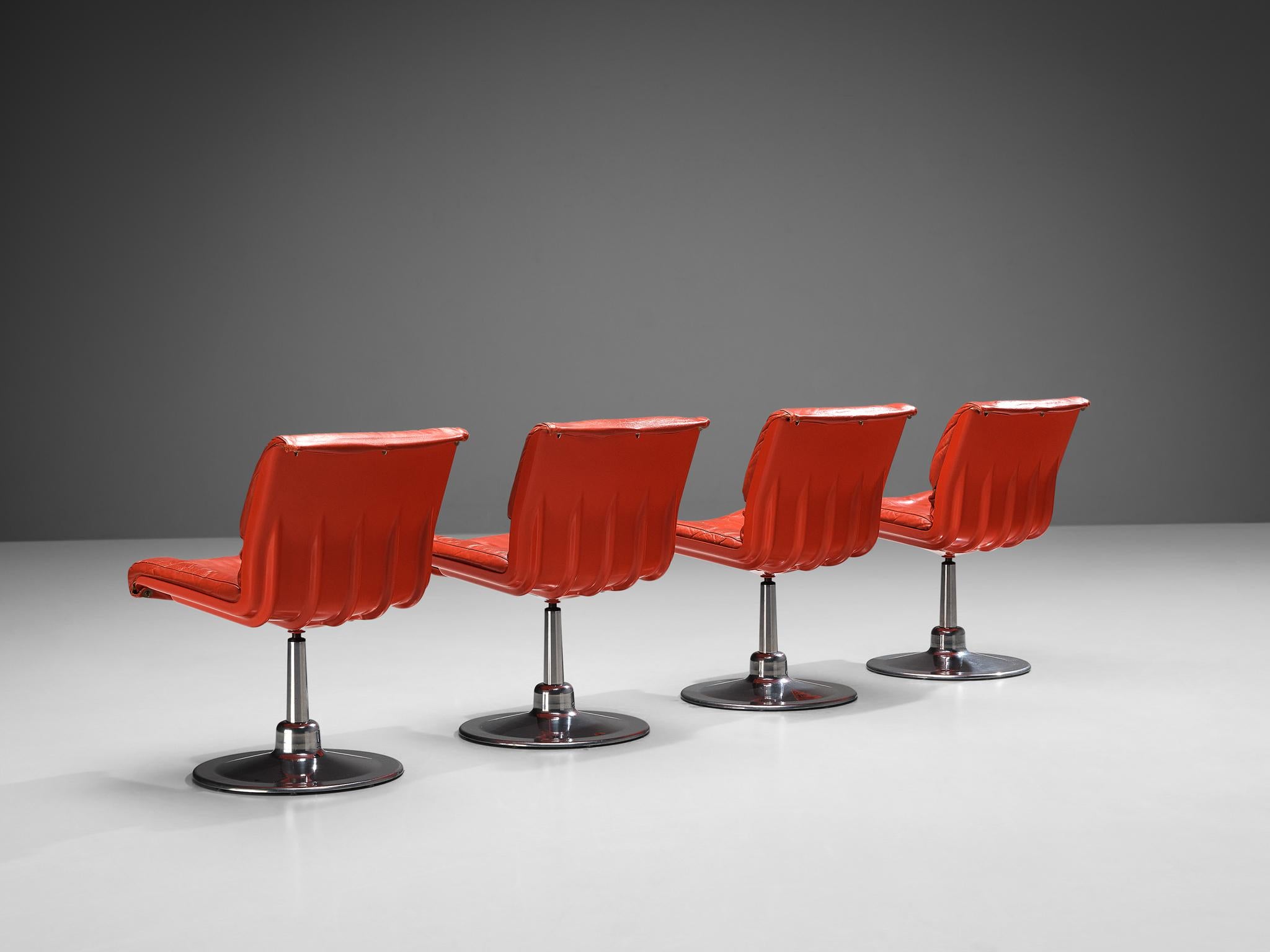 Yrjö Kukkapuro for Haimi Finland, set of four dining chairs, leather, fiberglass, aluminum, Finland, 1960s

These chairs are designed by the Finnish artist Yrjö Kukkapuro. This model consists of a molded fiberglass shell executed in a bright red