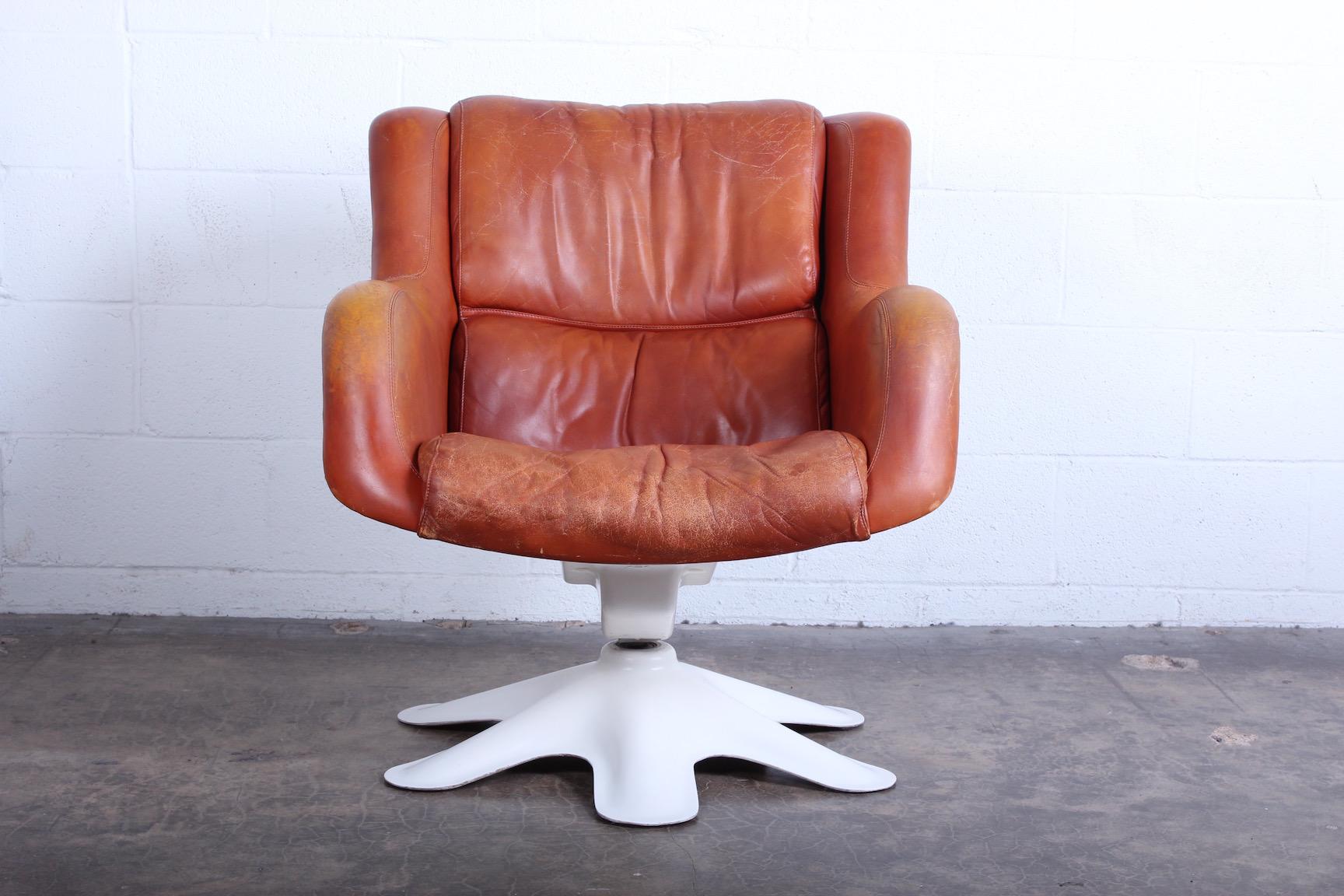 A well patinated leather 'Karuselli' tilt / swivel lounge chair by Yrjo Kukkapuro.