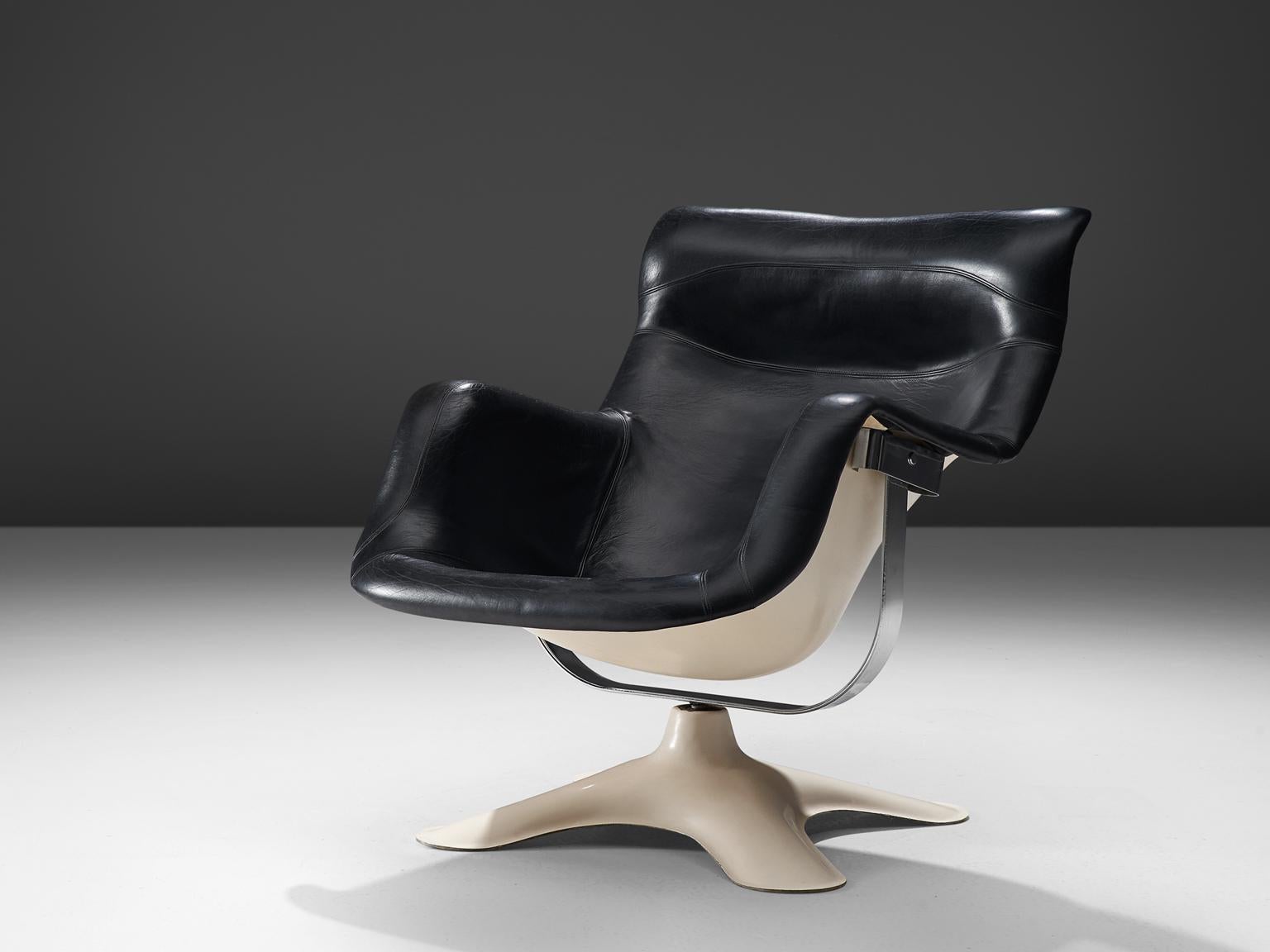 Yrjo Kukkapuro for Haimi, 'Karuselli' lounge chair, black leather, white fiberglass, Finland, 1960s.

Organic shaped lounge chair by Finnish designer Yrjo Kukkapuro. This chair consist of a moulded plastic shell with thick leather cushions on the