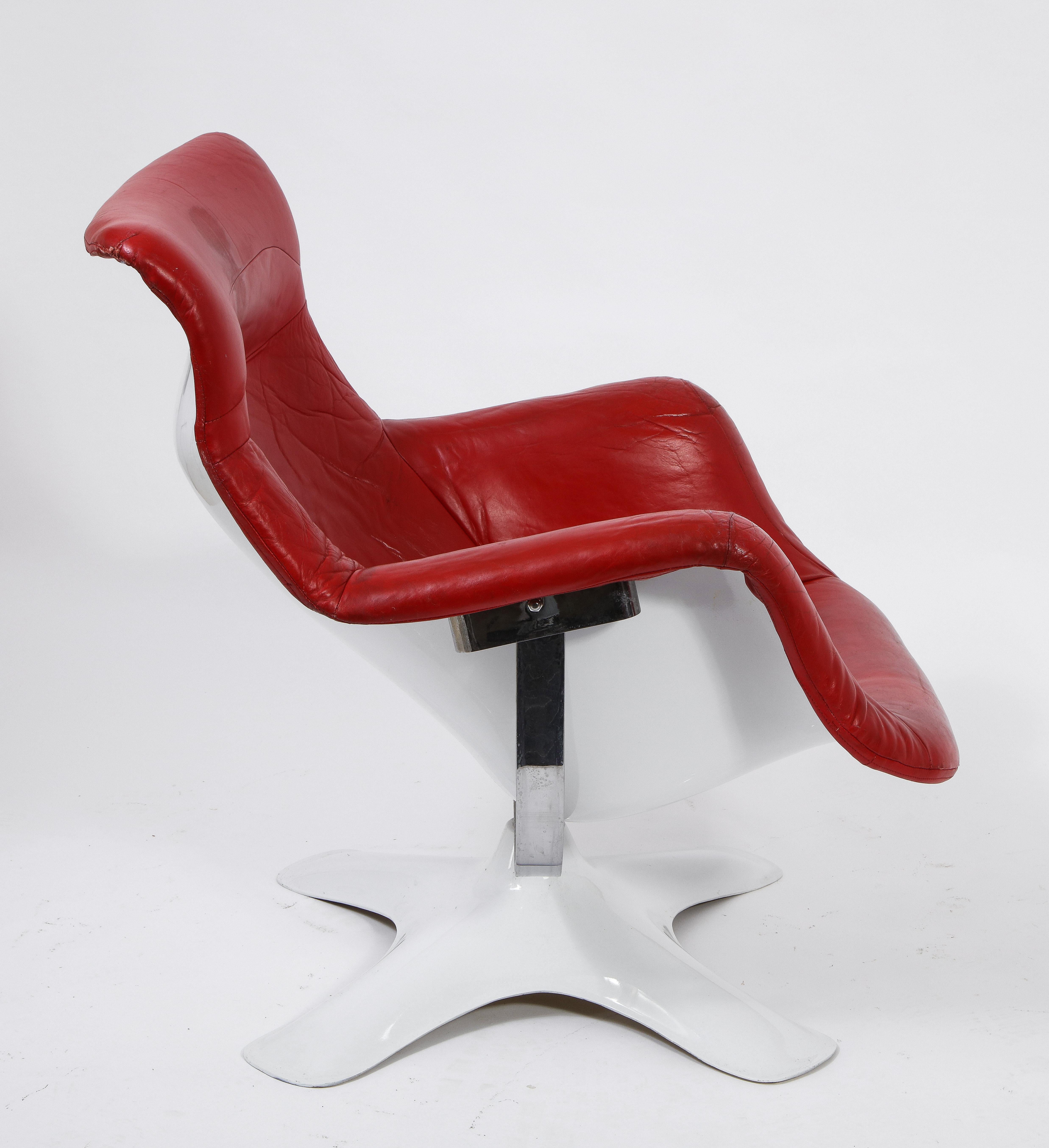 The Karuselli chair is Kukkapuro's crowning achievement. It is arguably among the most comfortable chair designs in existence. 

This example comes with the rare factory original red leather upholstery. Rarer still, the matching ottoman is also