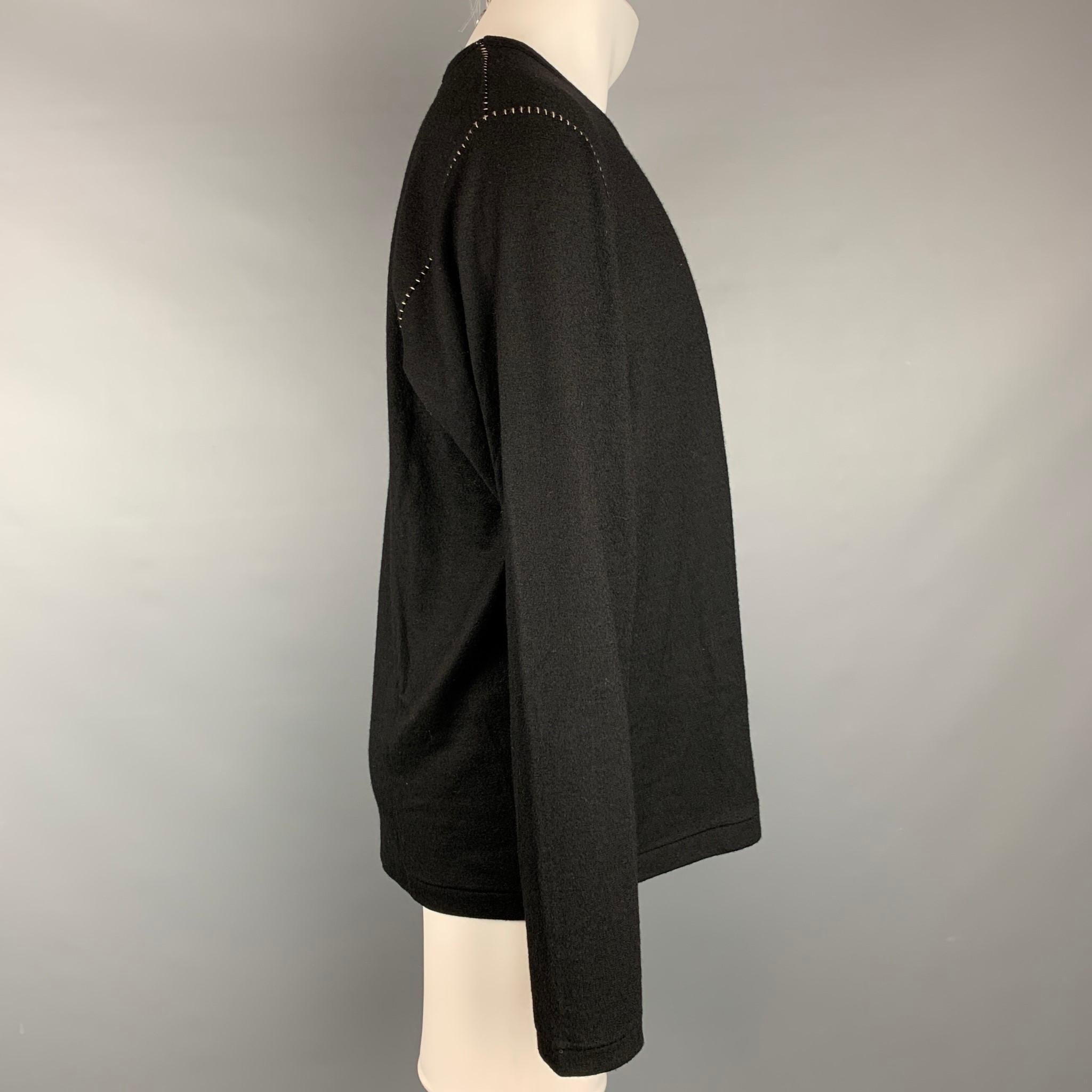 Y's by YOHJI YAMAMOTO pullover comes in a black wool with contrast stitching and a crew-neck. Made in Japan. 

Very Good Pre-Owned Condition.
Marked: JP 3

Measurements:

Shoulder: 19.5 in.
Chest: 44 in.
Sleeve: 27 in.
Length: 27.5 in. 

