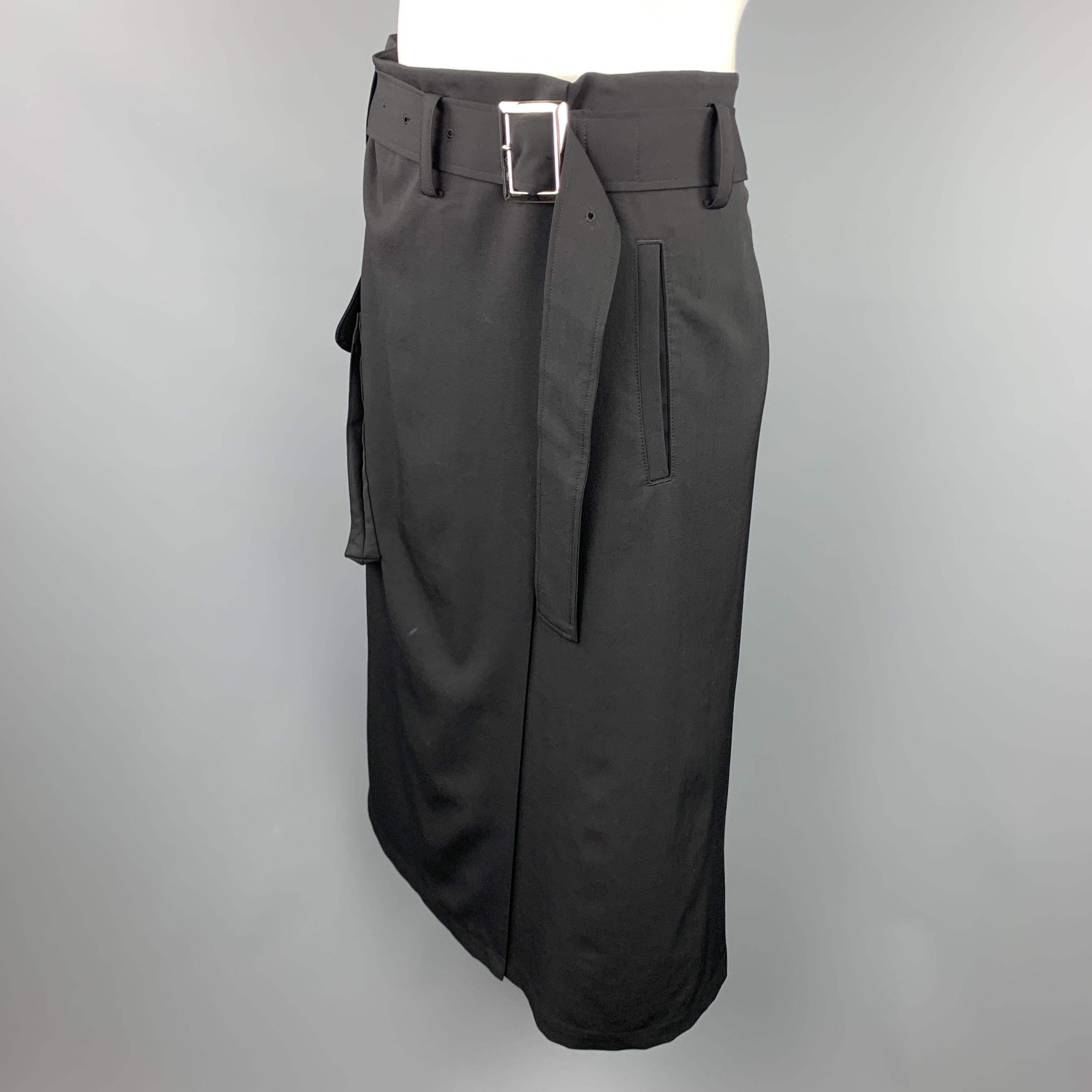 Y'S by YOHJI YAMAMOTO skort shorts come in black wool twill with a wrap skirt panel overlays , flap cargo pocket, and oversized waist that gathers with a matching fabric belt. Made in Japan.

Excellent Pre-Owned Condition.
Marked: JP