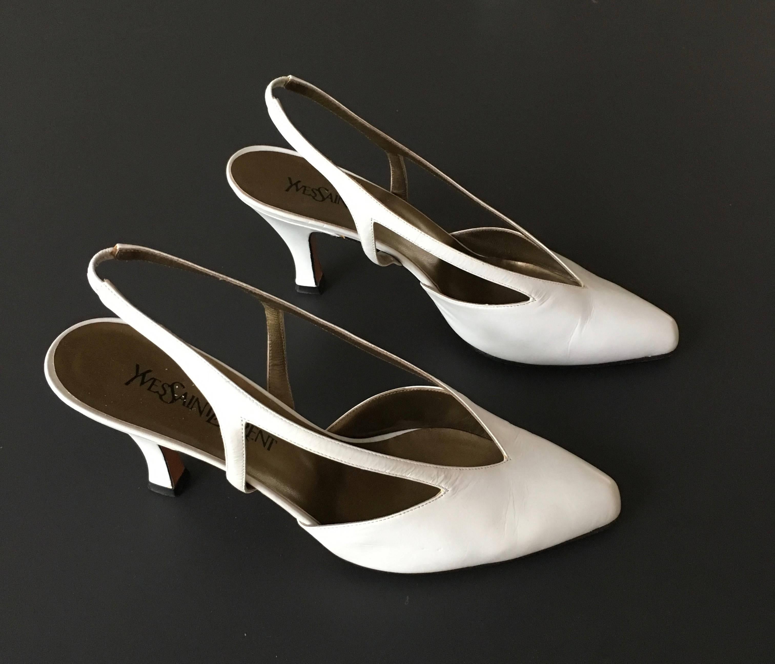 Yves Saint Laurent 1990s white leather slingback high heels is size 9.5 M.  Made in Italy.  Wear these YSL classic heels with your vintage 1980s Calvin Klein jeans or your Chanel cream pantsuit.
3. 1/2