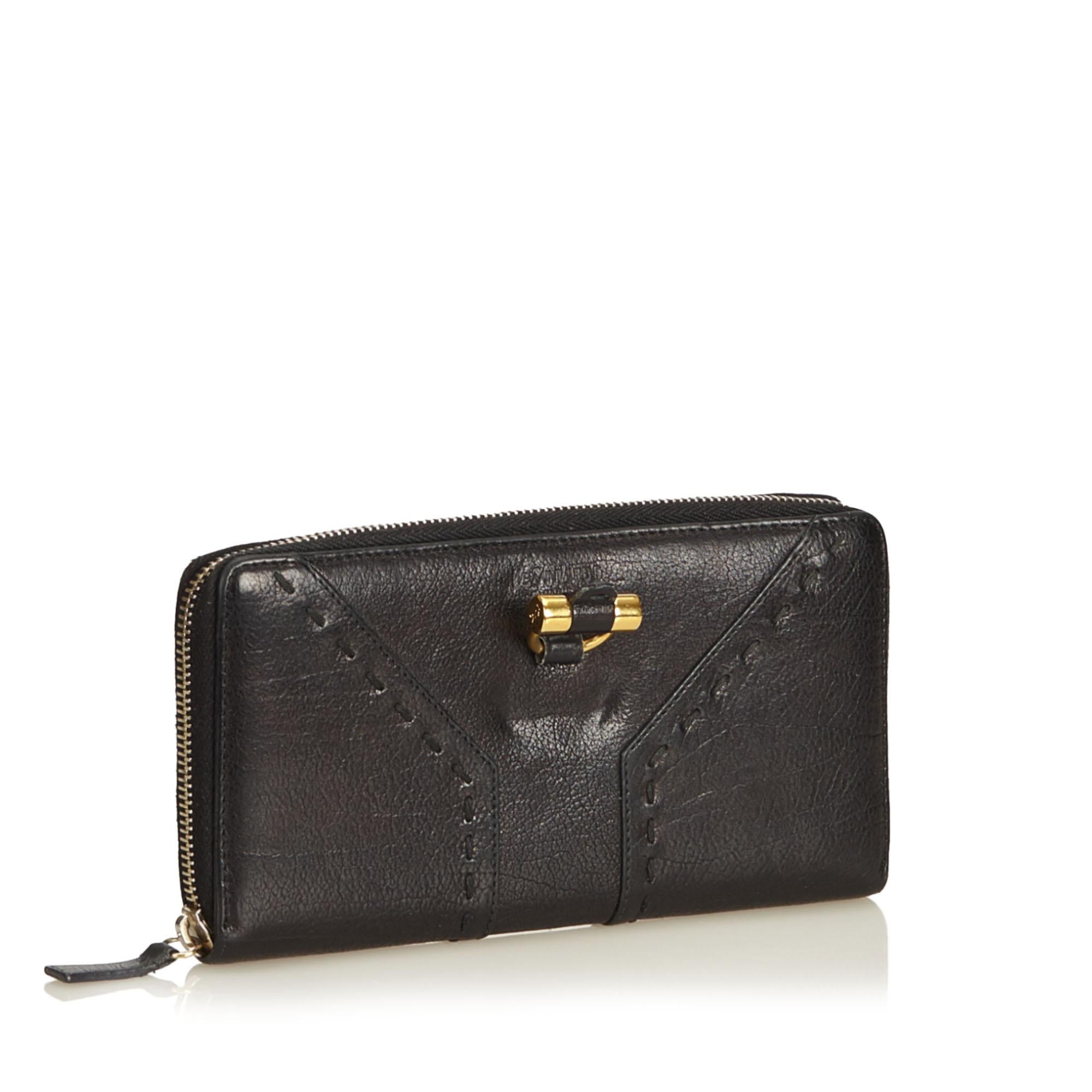 The Muse wallet features a leather body, gold-tone hardware, a zip around closure, an interior zip compartment, and interior slip pockets. It carries as B+ condition rating.

Inclusions: 
This item does not come with inclusions.

Dimensions:
Length: