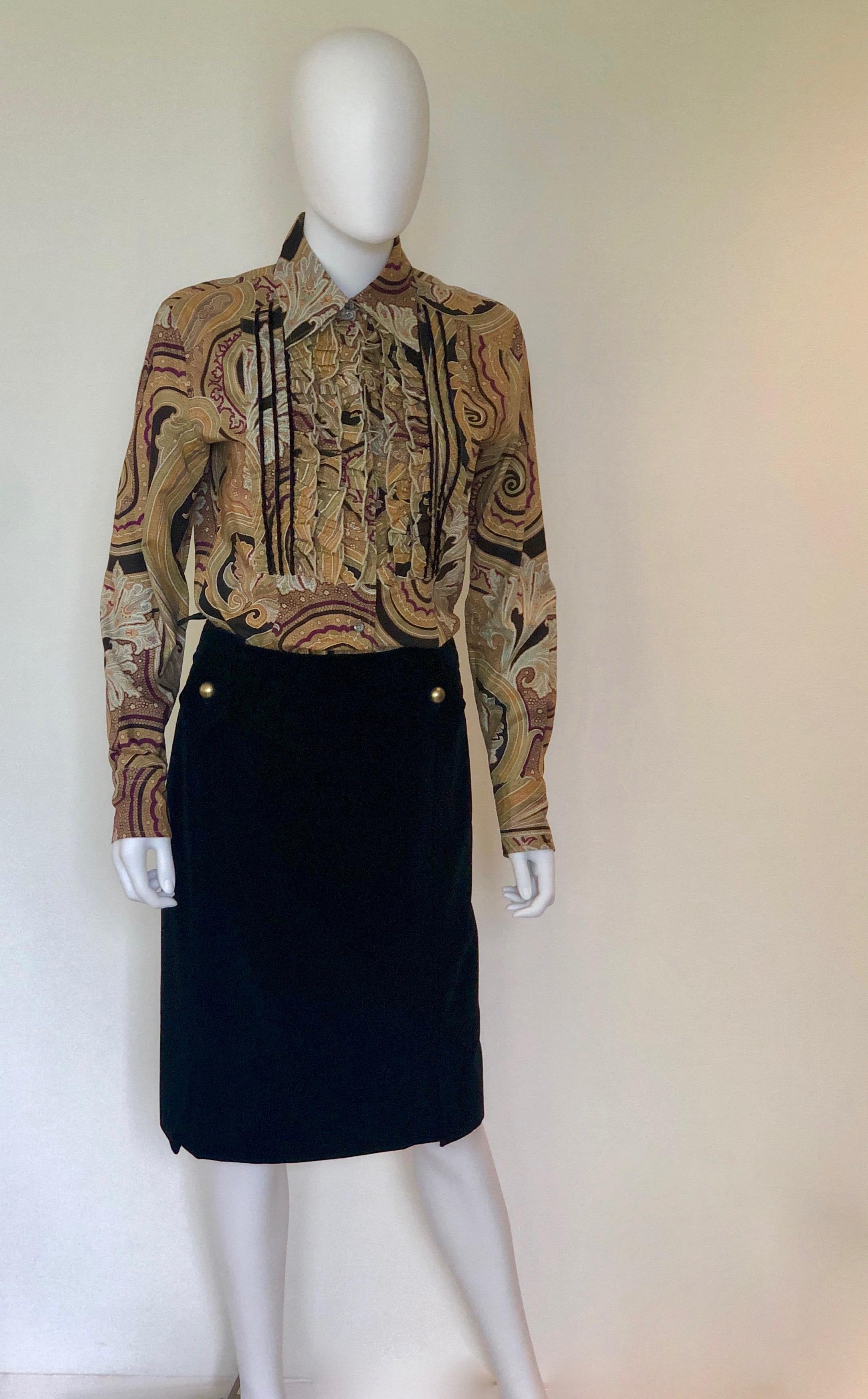 Make:  Yves Saint Laurent
Place of Manufacture:  Italy
Size: French 40
Materials:  Cotton and metal
Color:  Black
Style:  YSL black cotton pencil skirt that hits at the knee.  The skirt has a hidden zipper in the back.  The front of the skirt has to