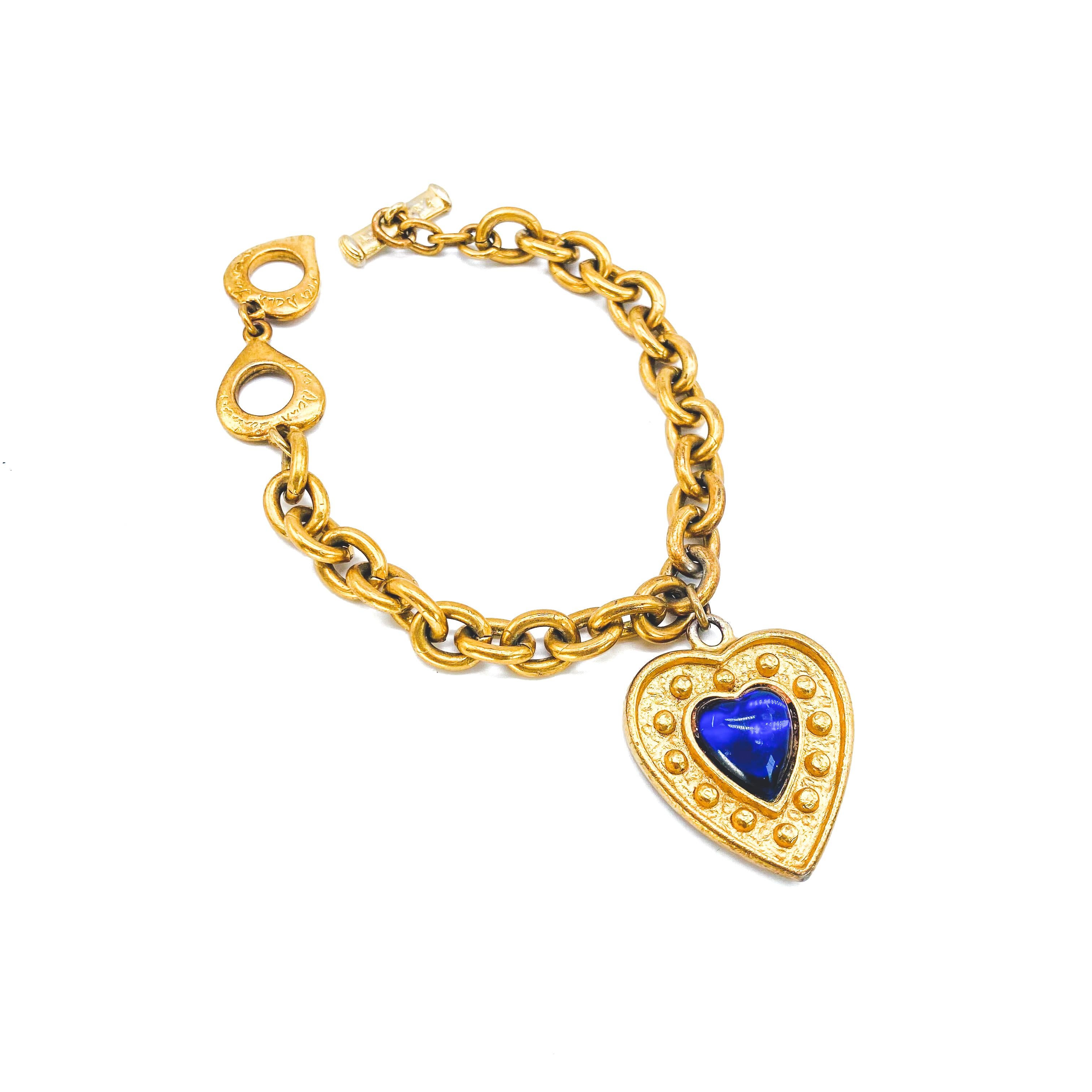 Yves Saint Laurent Vintage 1980s Bracelet

Detail
-Made in France in the late 1980s
-Expertly crafted from gold plated metal
-Chunky gold chain
-Large YSL heart shaped charm set with a lapis lazuli coloured stone

Size & Fit
-Length approx 7 inches