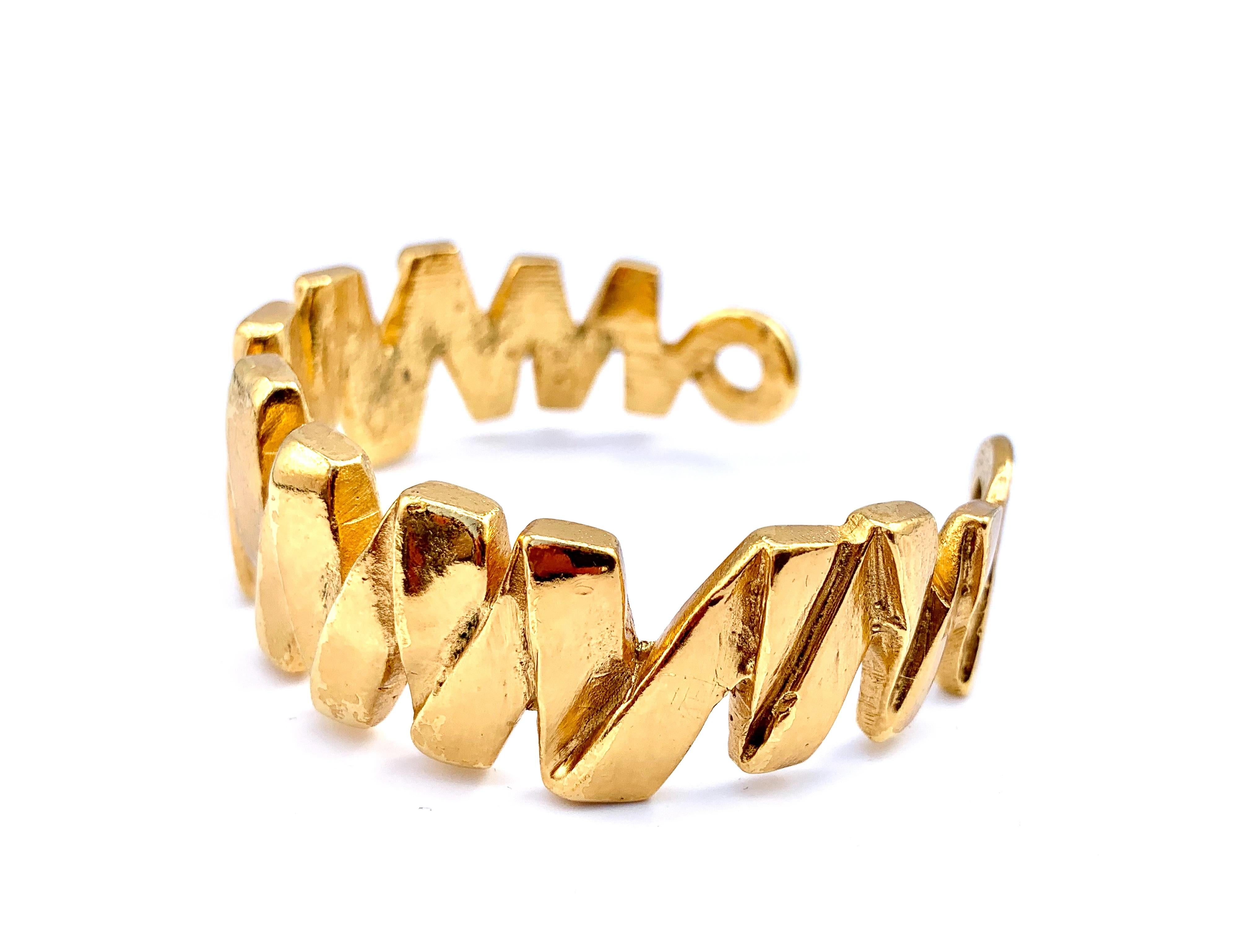 Yves Saint Laurent 1990s Statement Bracelet

 A striking vintage piece with contemporary styling from the iconic House of Yves Saint Laurent 

Detail
-Cast from a high quality sturdy gold plated metal
-Expertly crafted to create a folded zig zag