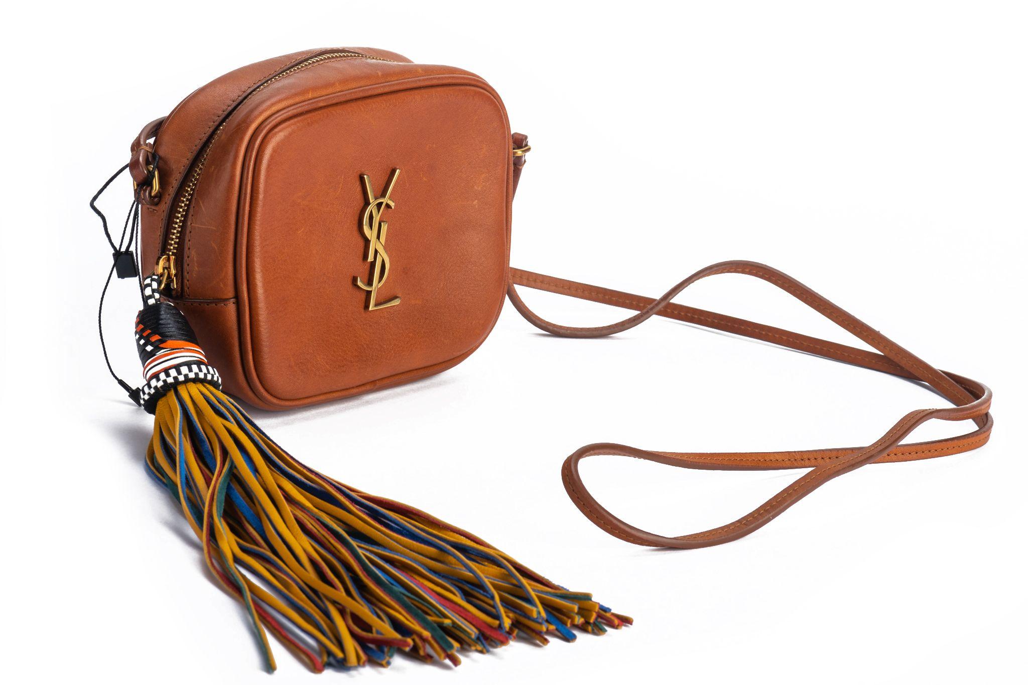 YSL brown barenia cross body bag with multicolor tassel. Shoulder drop 23.5. Comes with booklet and original dust cover. Brand new . 
