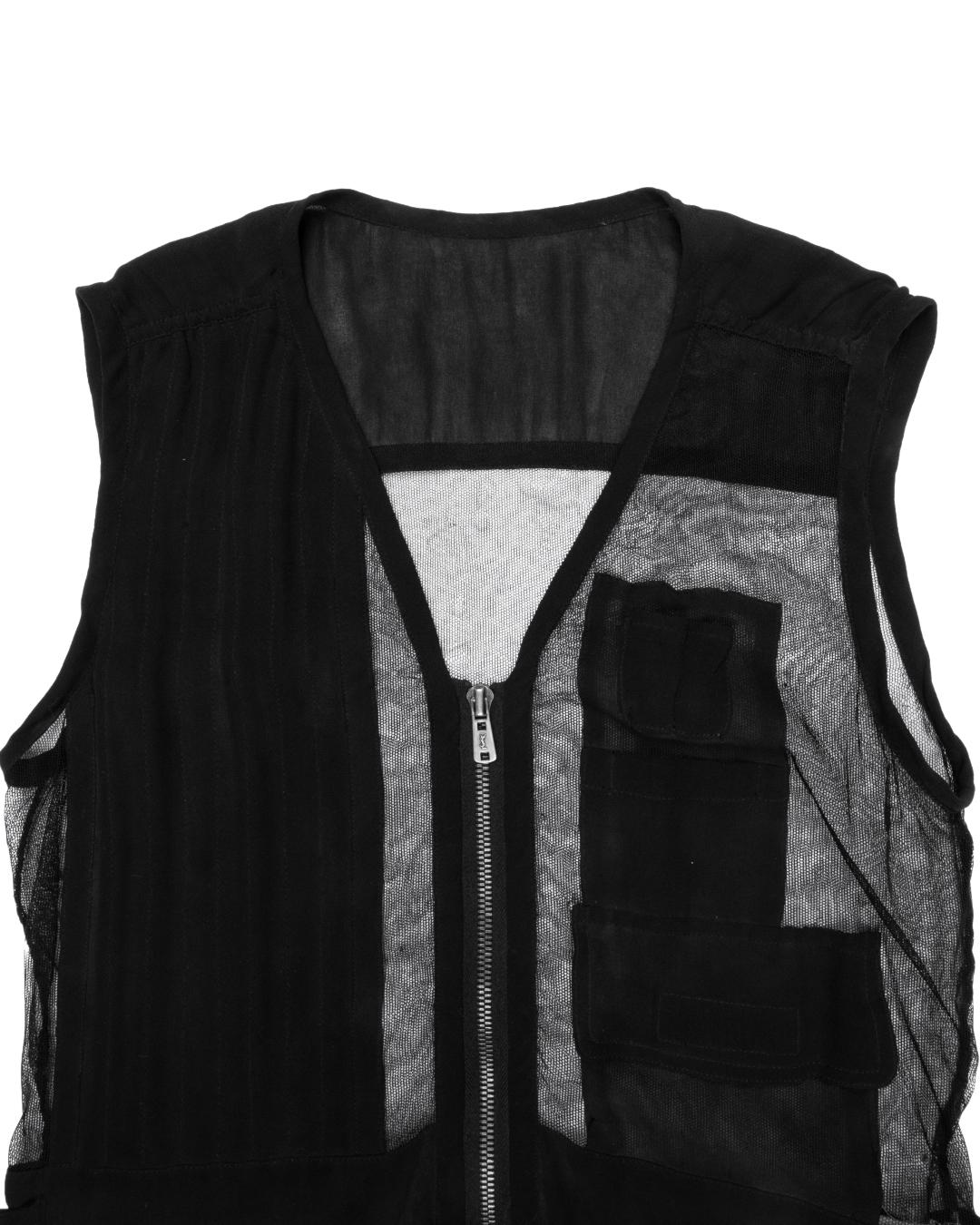 This striking silk vest is crafted from a thin sheet of netted silk, which is accented with applique chiffon cargo pockets. There is a shirring effect on both shoulders, while the center is left unlined and slightly sheer. All the hardware is