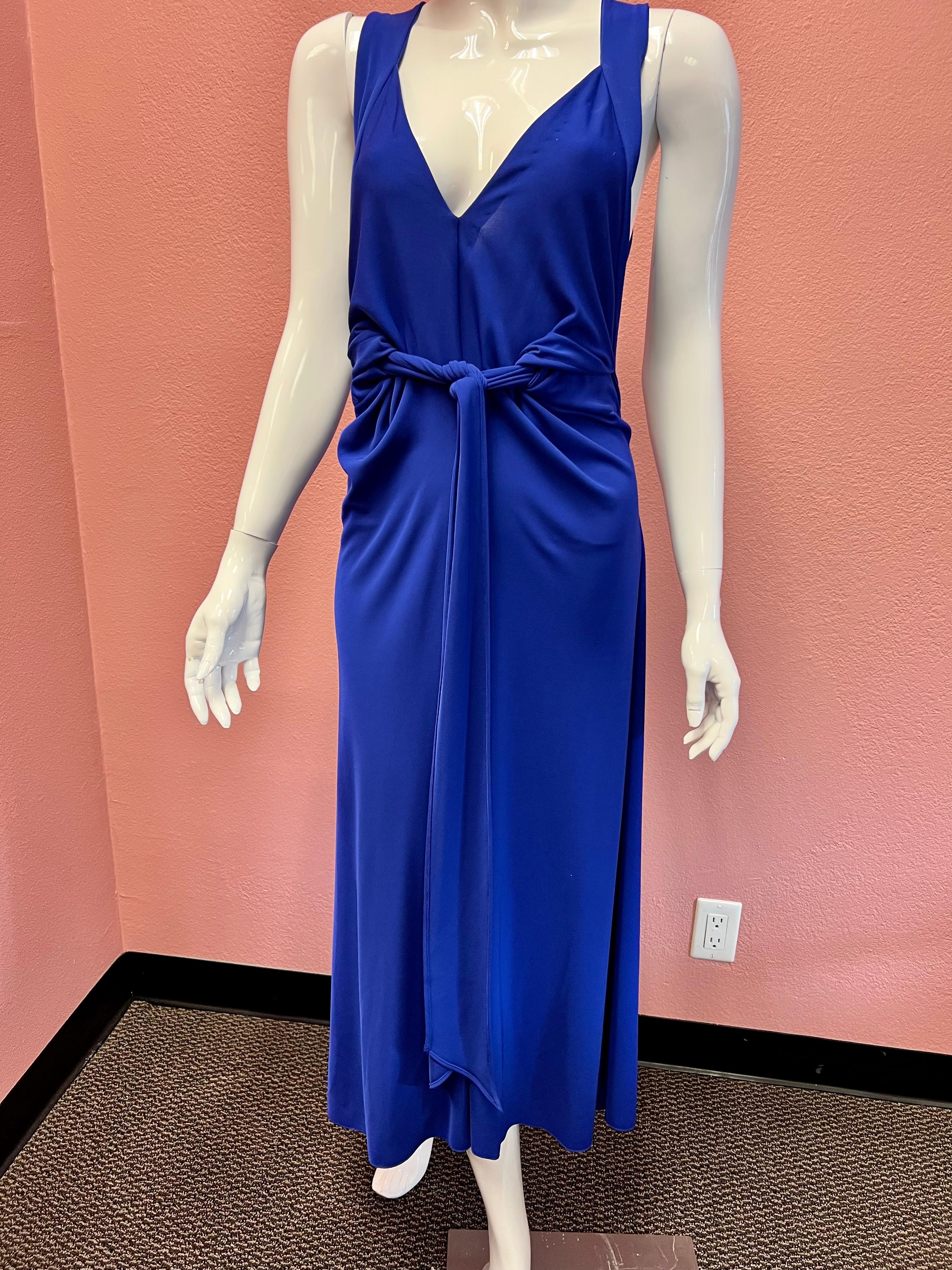 This dress is so classy and such a beautiful color. 

Indigo, sleeveless, ankle length with tie waist. 

The ability to tie it a the waist makes for a super flattering silhouette. 
Never been worn, tags are still on. 
Year 2010 Season Fall
Size F38.