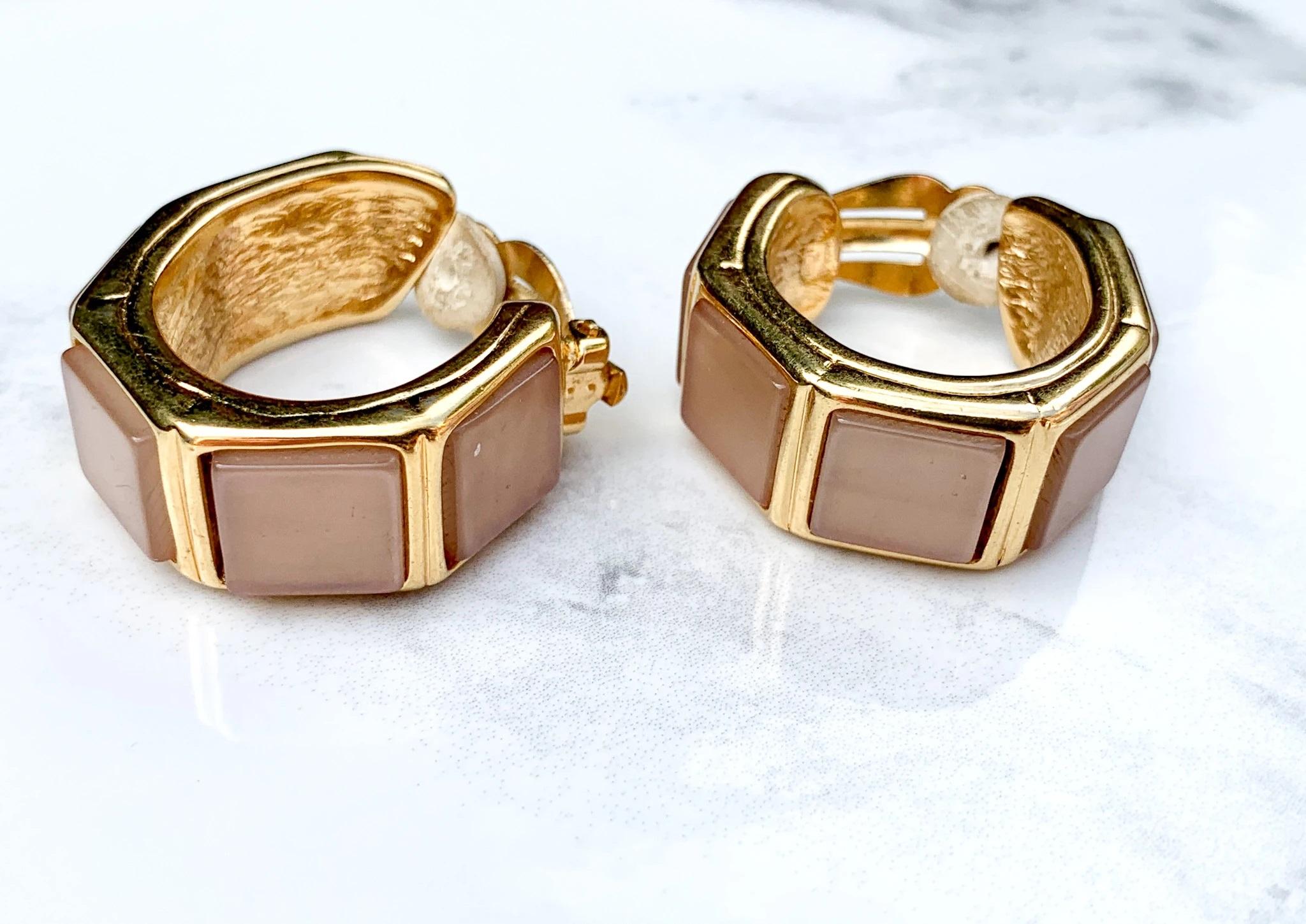 Yves Saint Laurent YSL 1980s Vintage Clip On Earrings. 

Cast from gold plated metal and set with a luminescent oyster colored enamel. 

Fully authenticated by experts. Signed with the iconic YSL logo of the era inside each earrings. 

Excellent