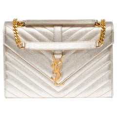 YSL Envelope MM shoulder bag in metallic gold champagne chevron leather
