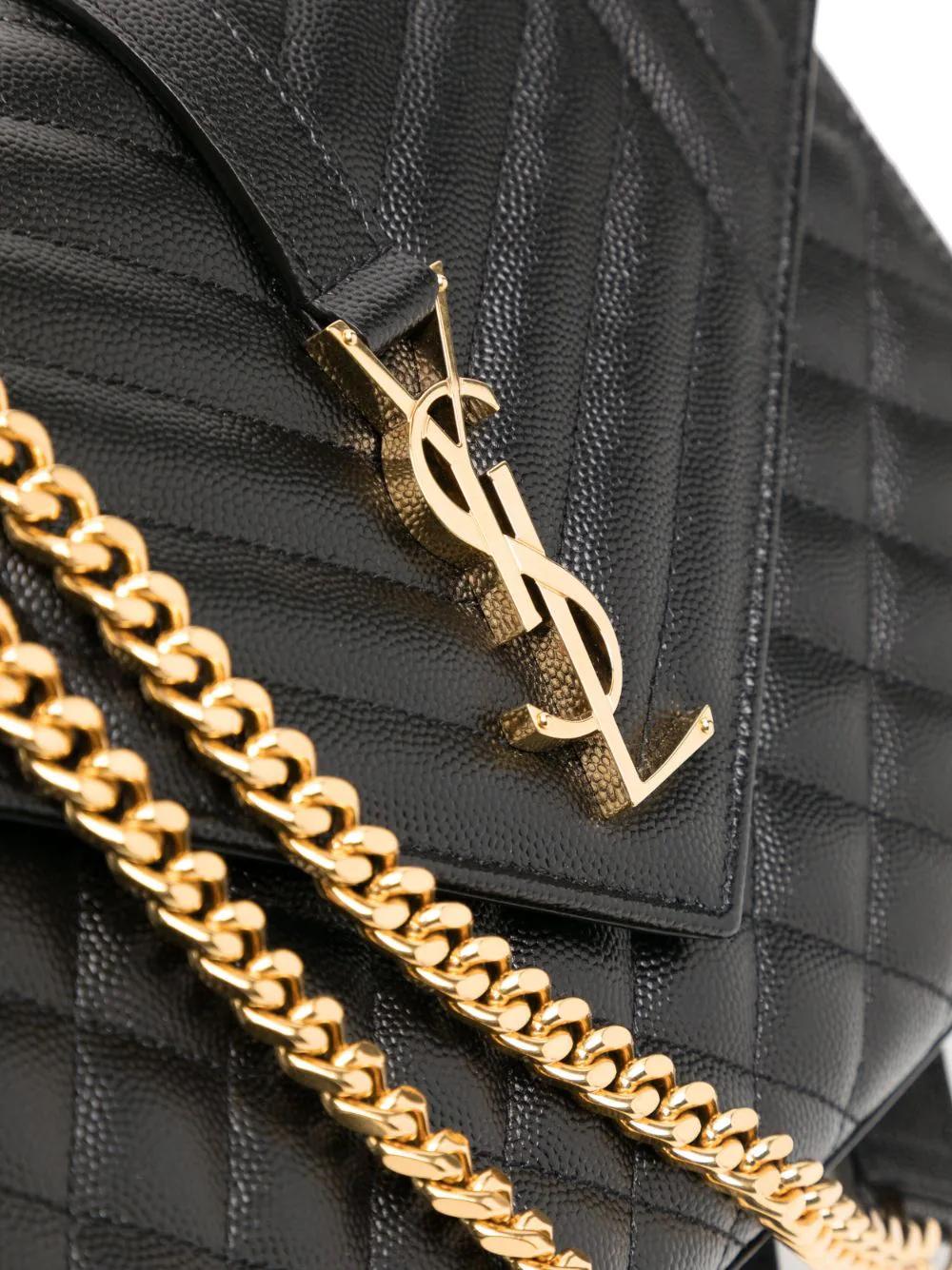 Expertly crafted YSL shoulder bag made of calf leather with diamond quilting and chevron stitching. Featuring a fold-over top with signature YSL logo plaque and chain-link shoulder strap. Gold-tone hardware. The condition of this bag is excellent.